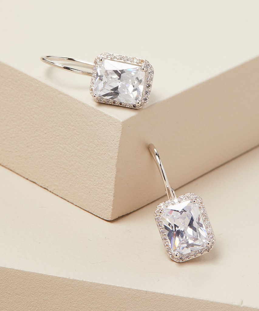 Emerald Cut 2.50 Cttw Gemstone Leverback Earrings in 14K White Gold Plating, showcasing elegant design and brilliant white stones.