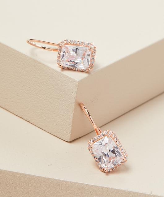 Elegant Emerald Cut Leverback Earrings in 14K Rose Gold Plating, featuring white stones and a comfortable design.