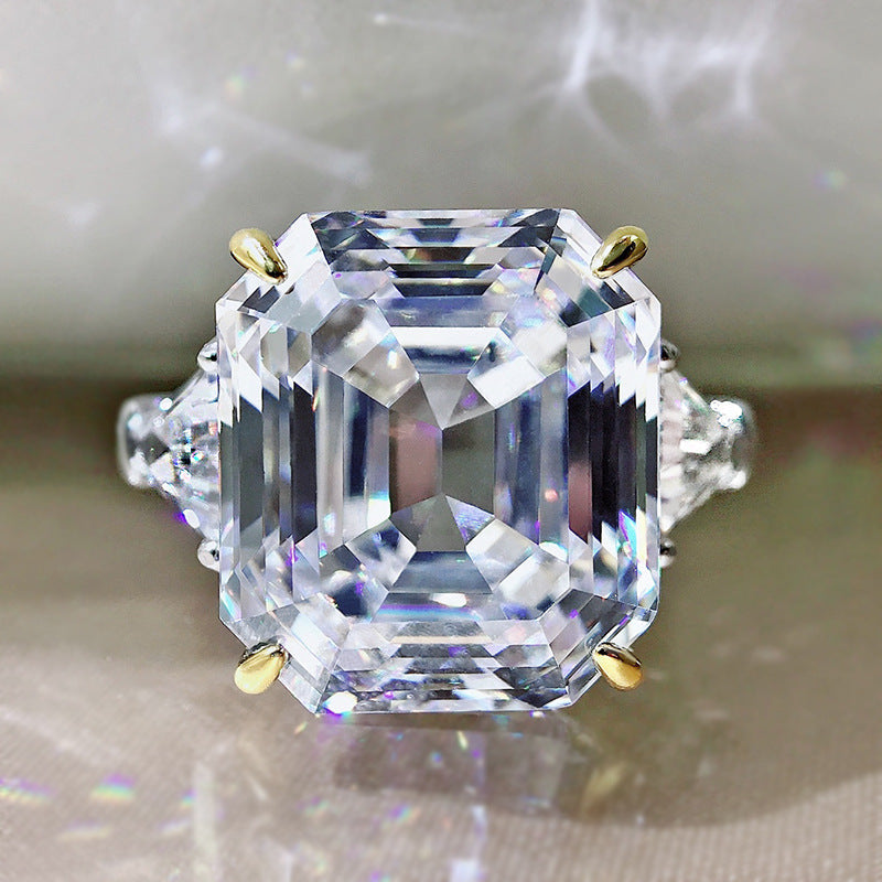 Emerald cut fancy engagement wedding ring in 925 sterling silver with white gold fill, showcasing a sparkling diamond.