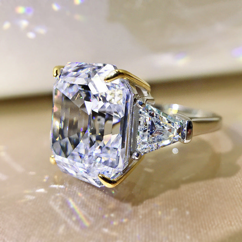 Emerald cut fancy engagement wedding ring in 925 sterling silver with white gold fill, showcasing a sparkling diamond.