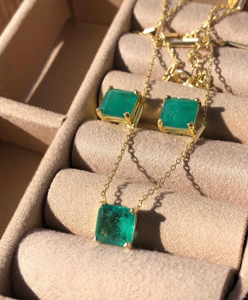 Elegant EMERALD Paraiba Bundle featuring a necklace and earrings set with vibrant green paraiba stones and yellow gold plating.