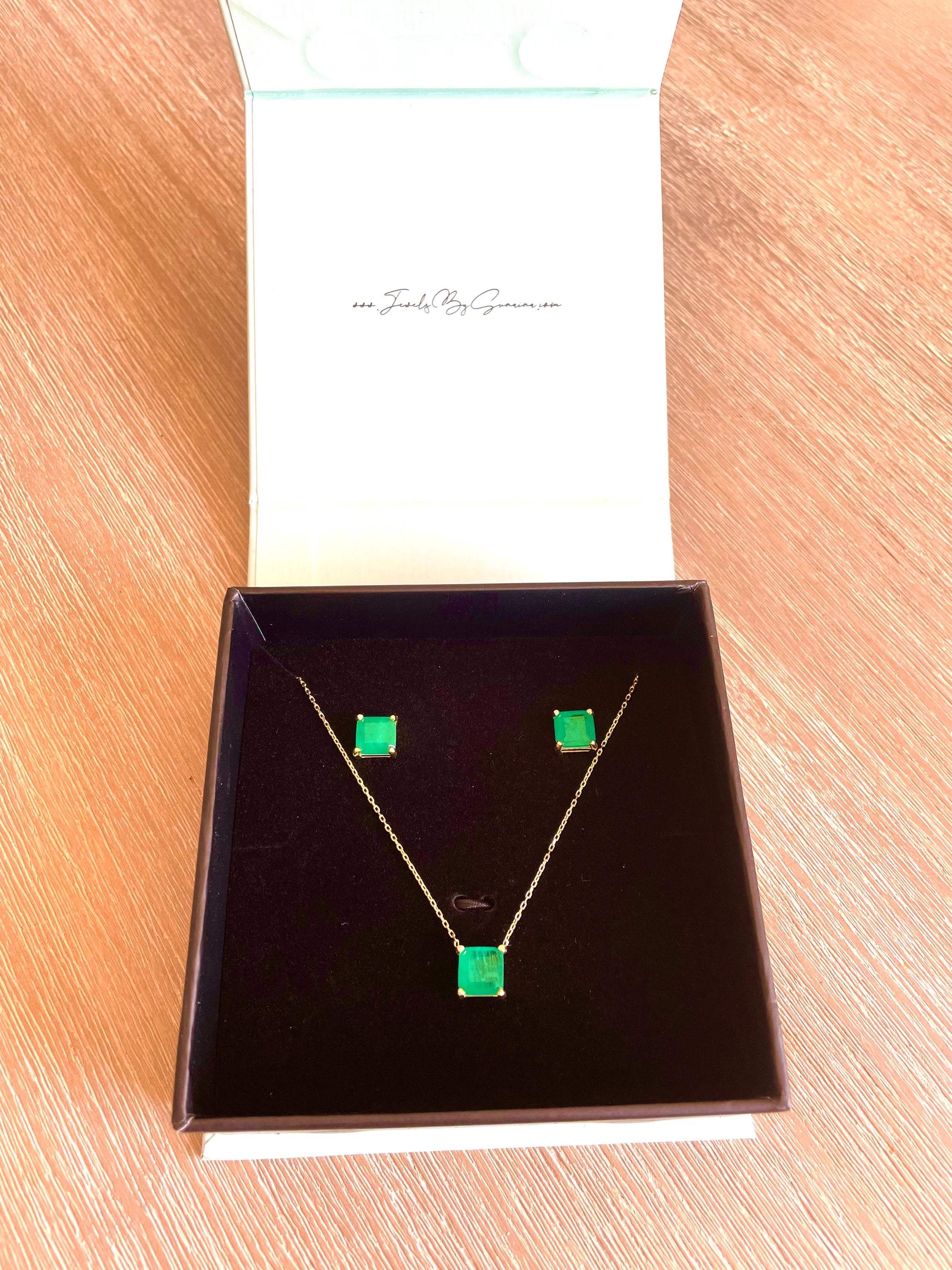 Elegant EMERALD Paraiba Bundle featuring a necklace and earrings set with vibrant green paraiba stones and yellow gold plating.