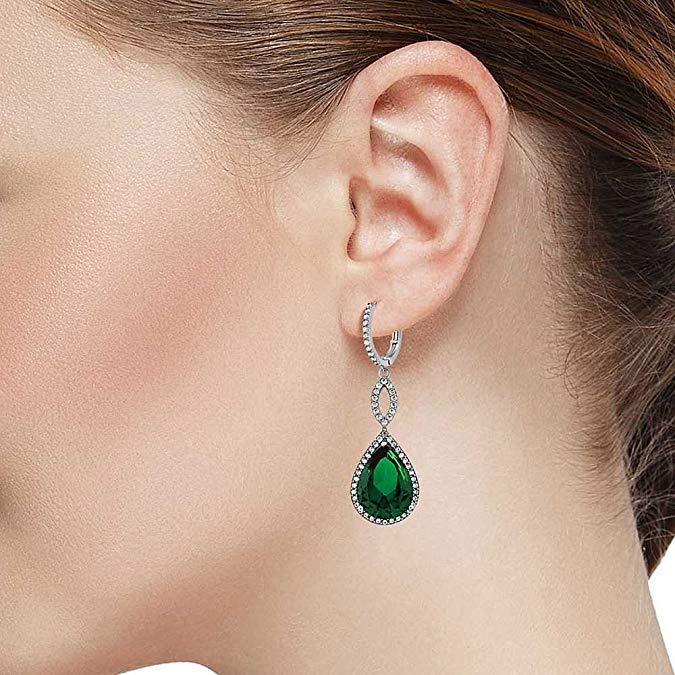 Emerald Pave Teardrop Infinity Drop earrings embellished with certified crystals, crafted in 18K white gold, showcasing elegance and sophistication.