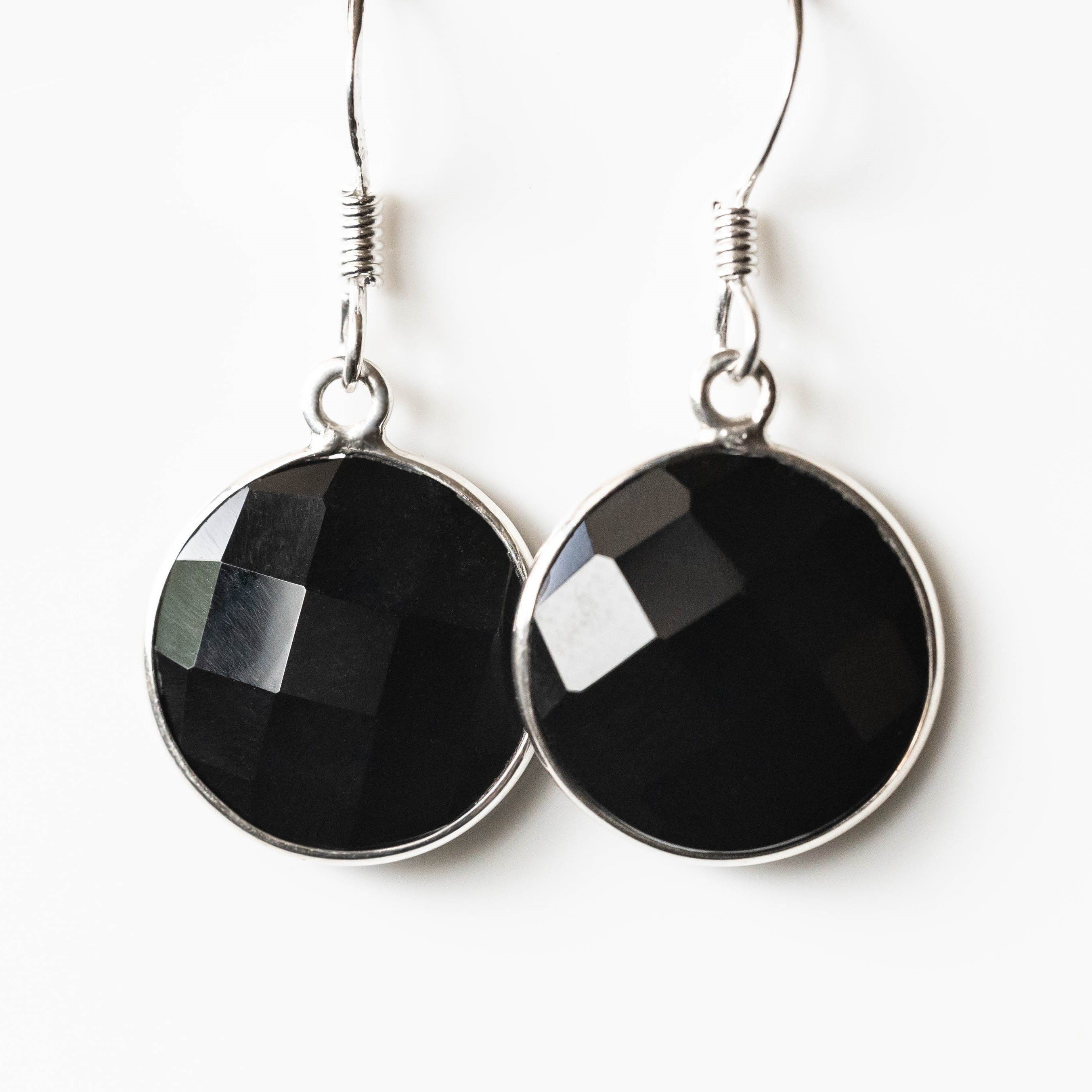 Emily Black Onyx Round Drop Earrings made of 925 sterling silver with rhodium plating, featuring 14 mm black onyx stones.