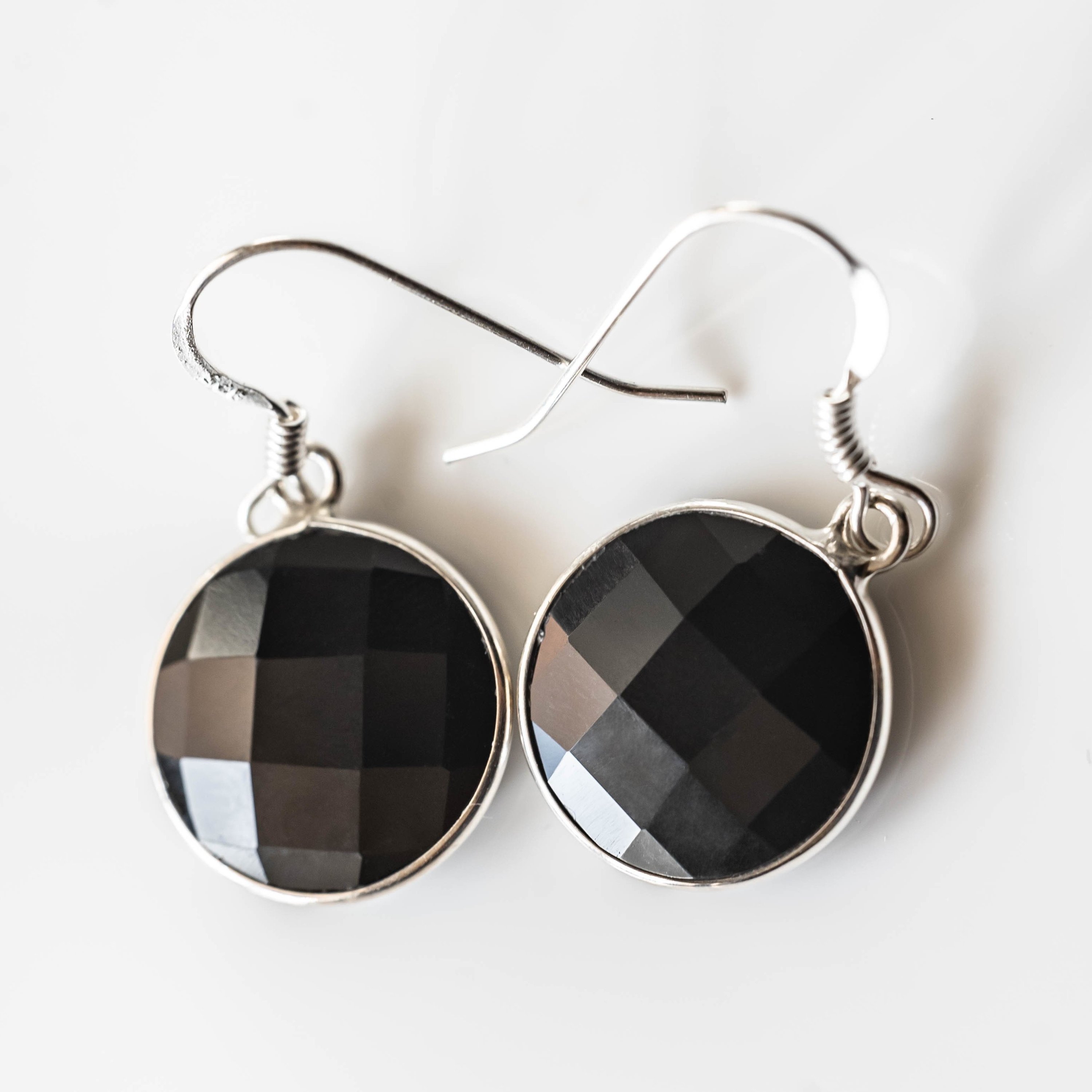 Emily Black Onyx Round Drop Earrings made of 925 sterling silver with rhodium plating, featuring 14 mm black onyx stones.