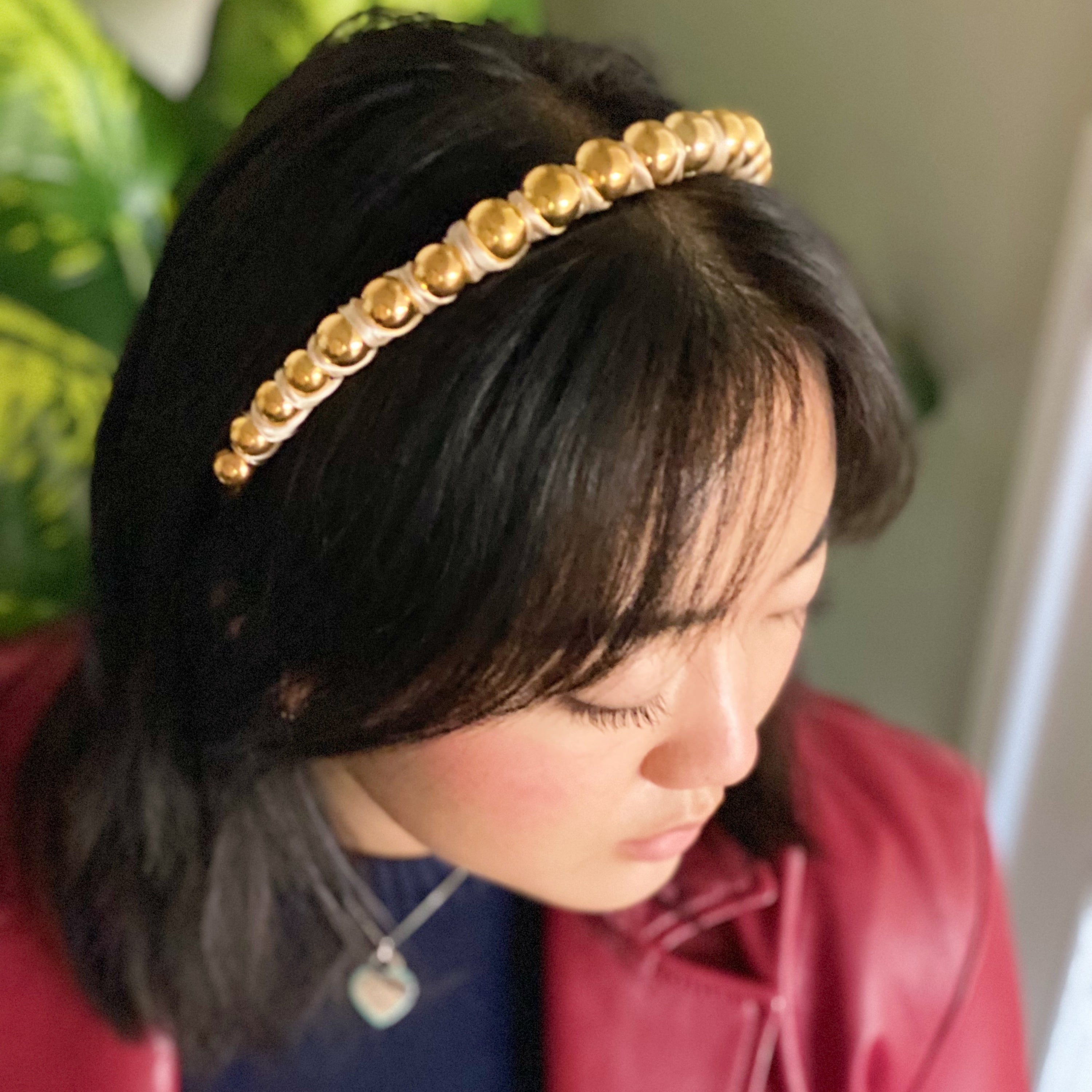 Emily Satin Wrapped Headband featuring golden ball beads and silky satin fabric, elegantly designed for comfort and style.