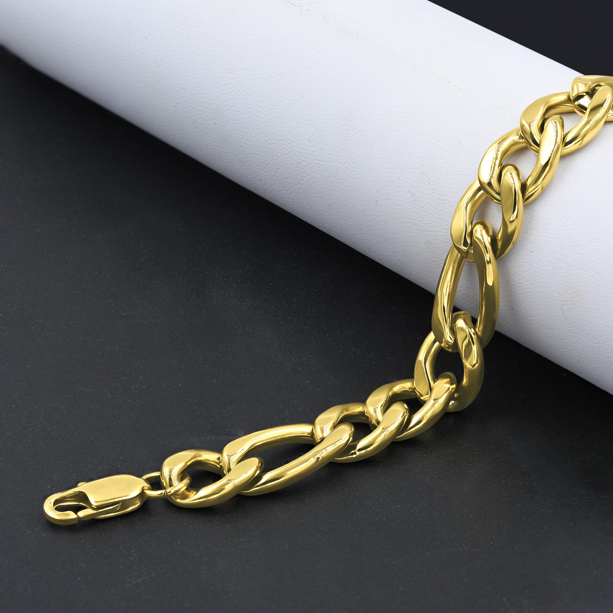 EMINENCE 12MM 8.5" Figaro Bracelet showcasing intricate design and luxurious gold finish.