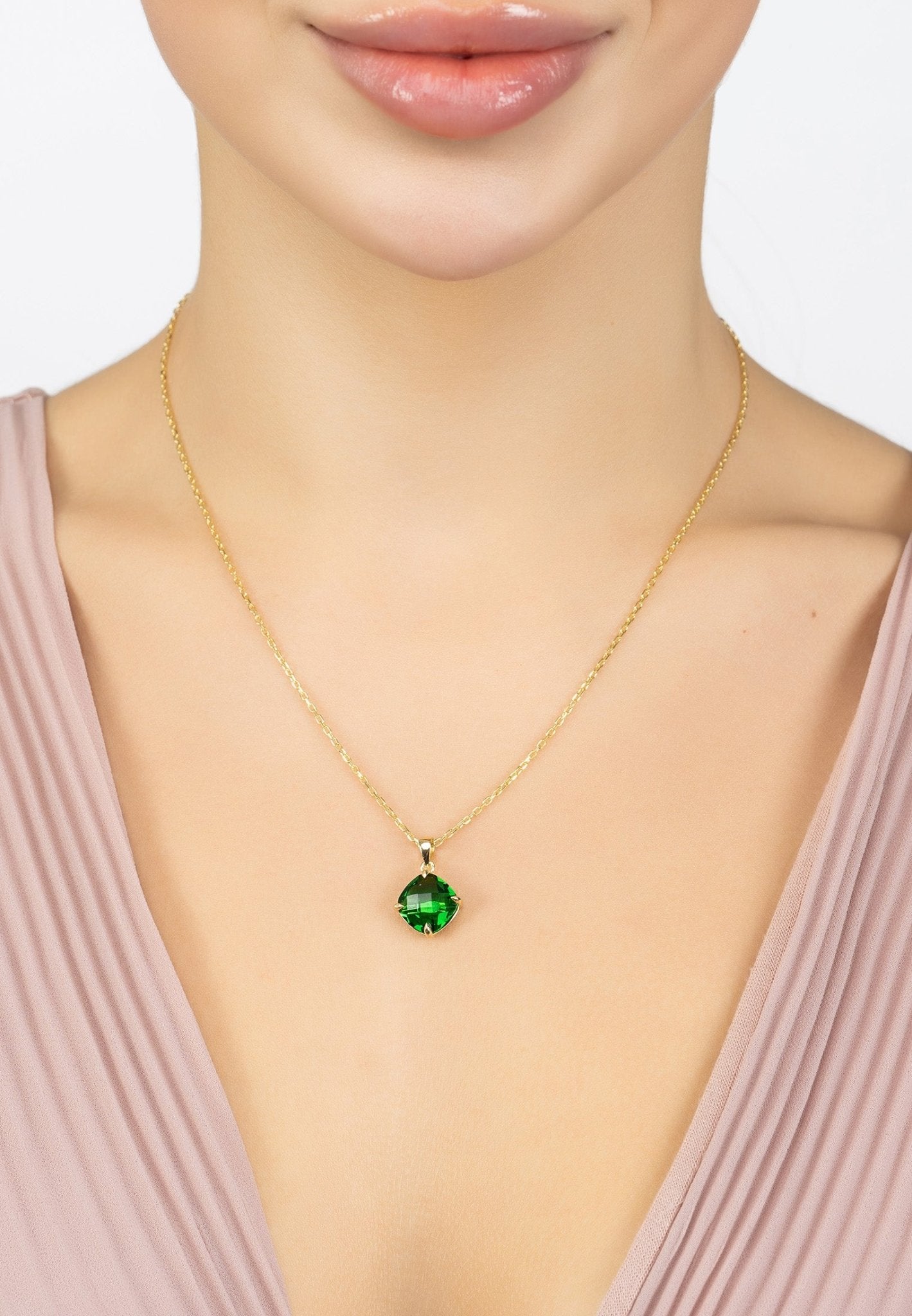 Empress Gemstone Necklace featuring a gold-dipped chain and a vibrant emerald gemstone, elegantly designed for any occasion.