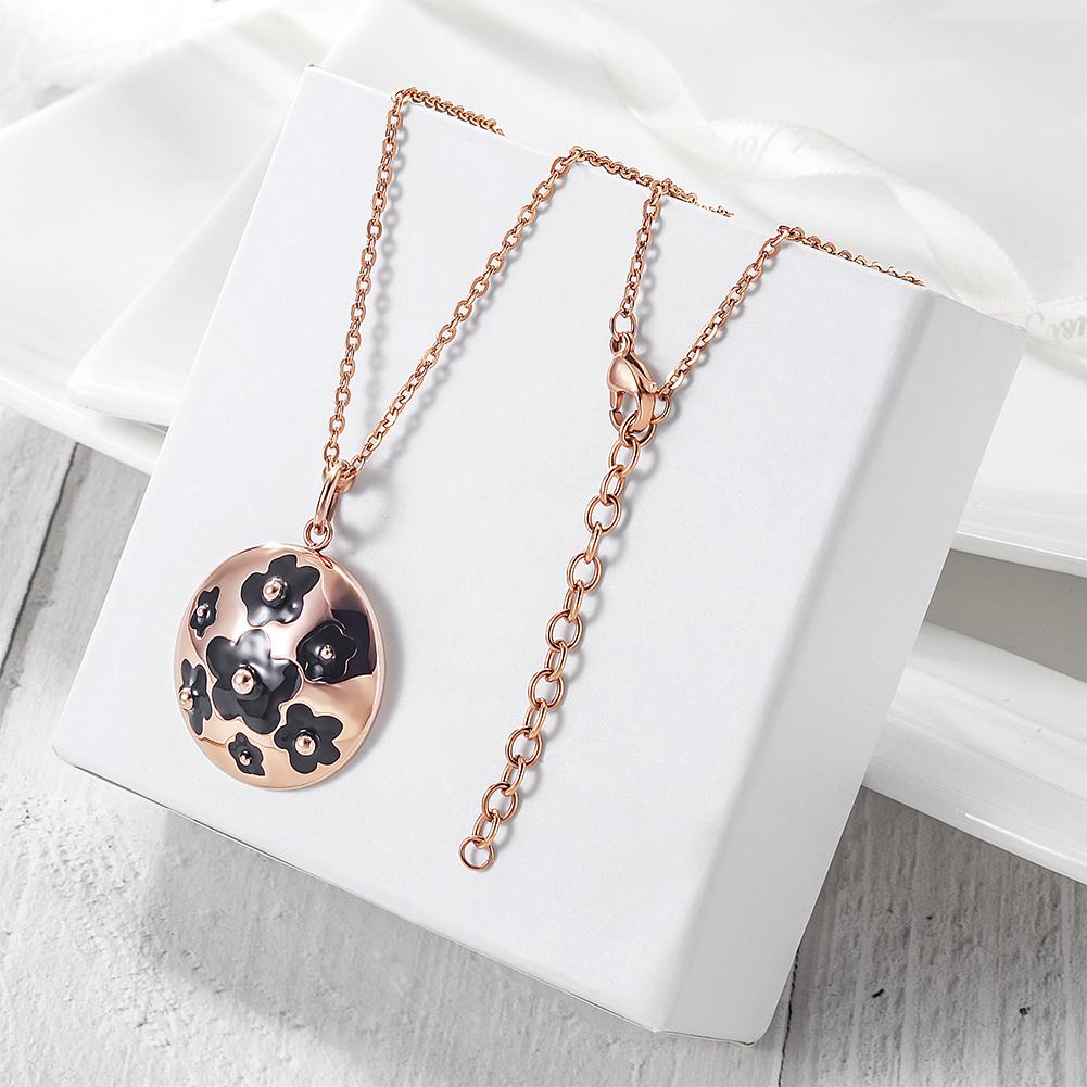 Elegant Enamel Clover Pendant Necklace made of stainless steel with gold plating, featuring a colorful clover design.