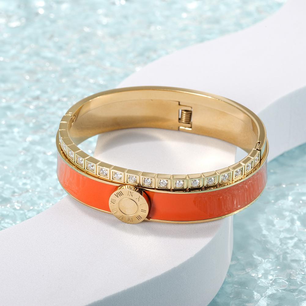 A stylish Enamel Pavé Bangle Set featuring CZ stones and Roman numerals, elegantly displayed in a gift box.