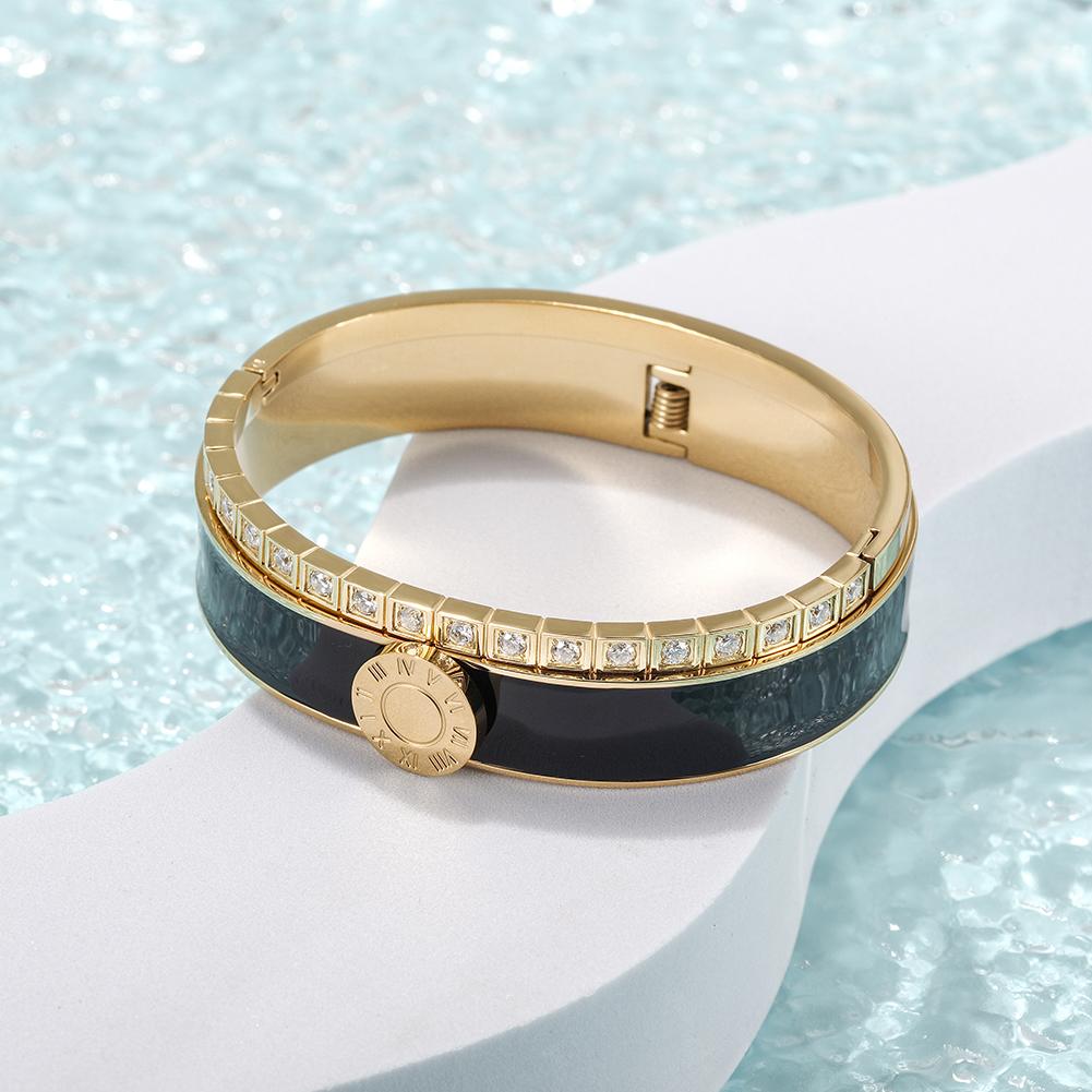 A stylish Enamel Pavé Bangle Set featuring CZ stones and Roman numerals, elegantly displayed in a gift box.