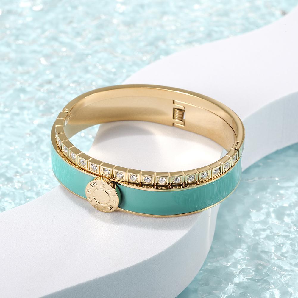 A stylish Enamel Pavé Bangle Set featuring CZ stones and Roman numerals, elegantly displayed in a gift box.