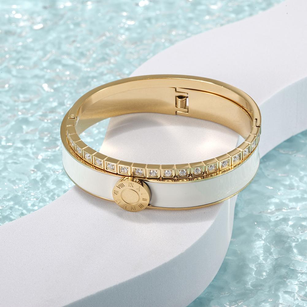 A stylish Enamel Pavé Bangle Set featuring CZ stones and Roman numerals, elegantly displayed in a gift box.