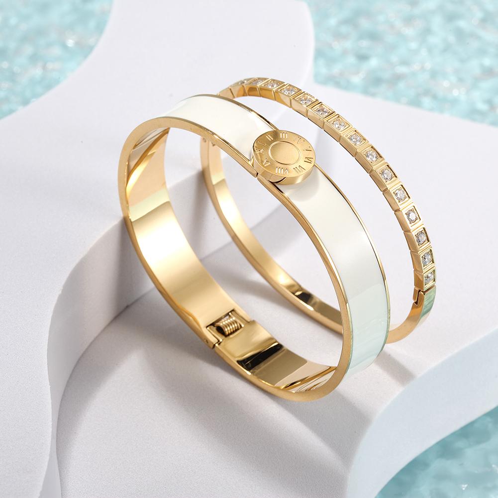 A stylish Enamel Pavé Bangle Set featuring CZ stones and Roman numerals, elegantly displayed in a gift box.