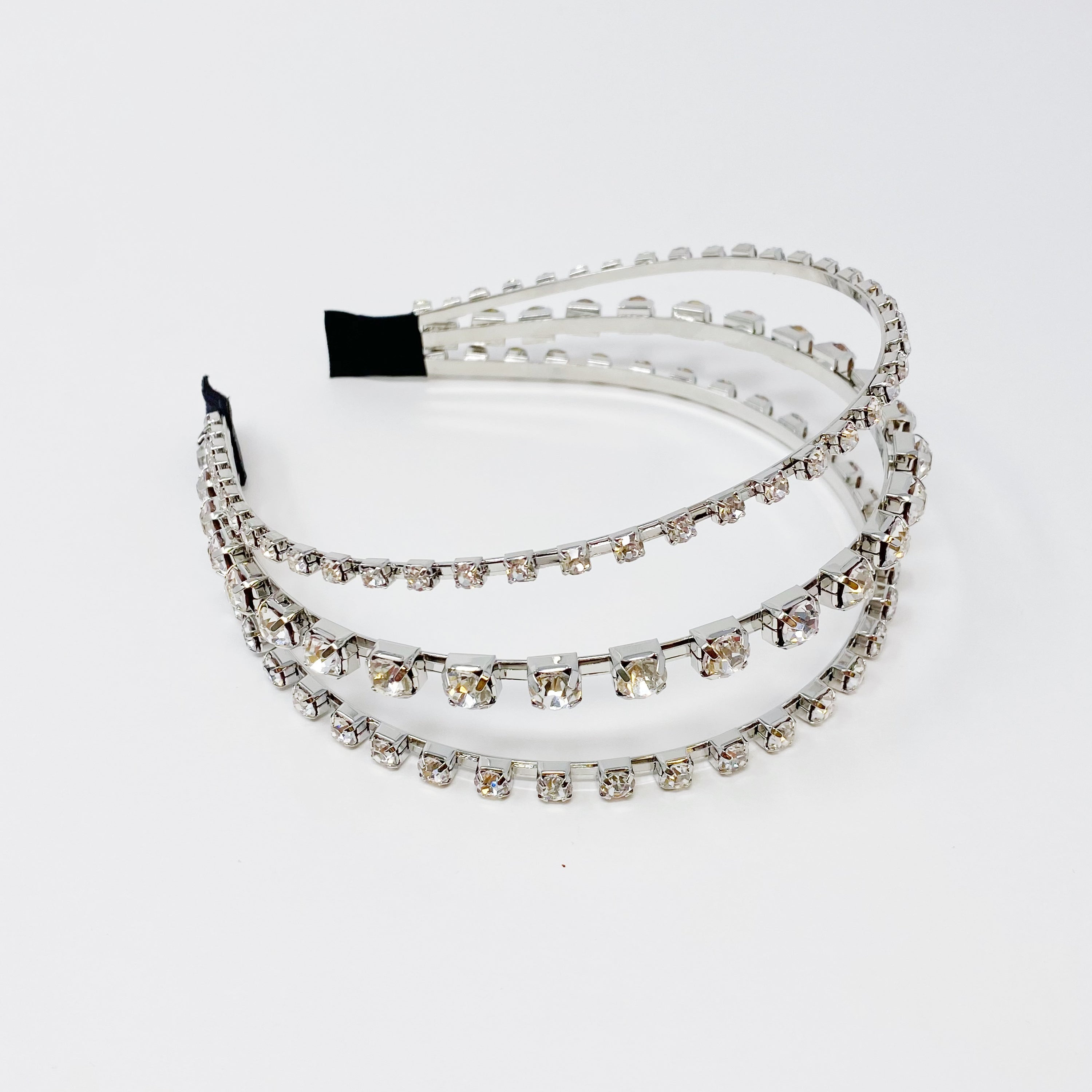 Ensemble Of Shine Headband featuring three embellished rows and soft edges for comfort.