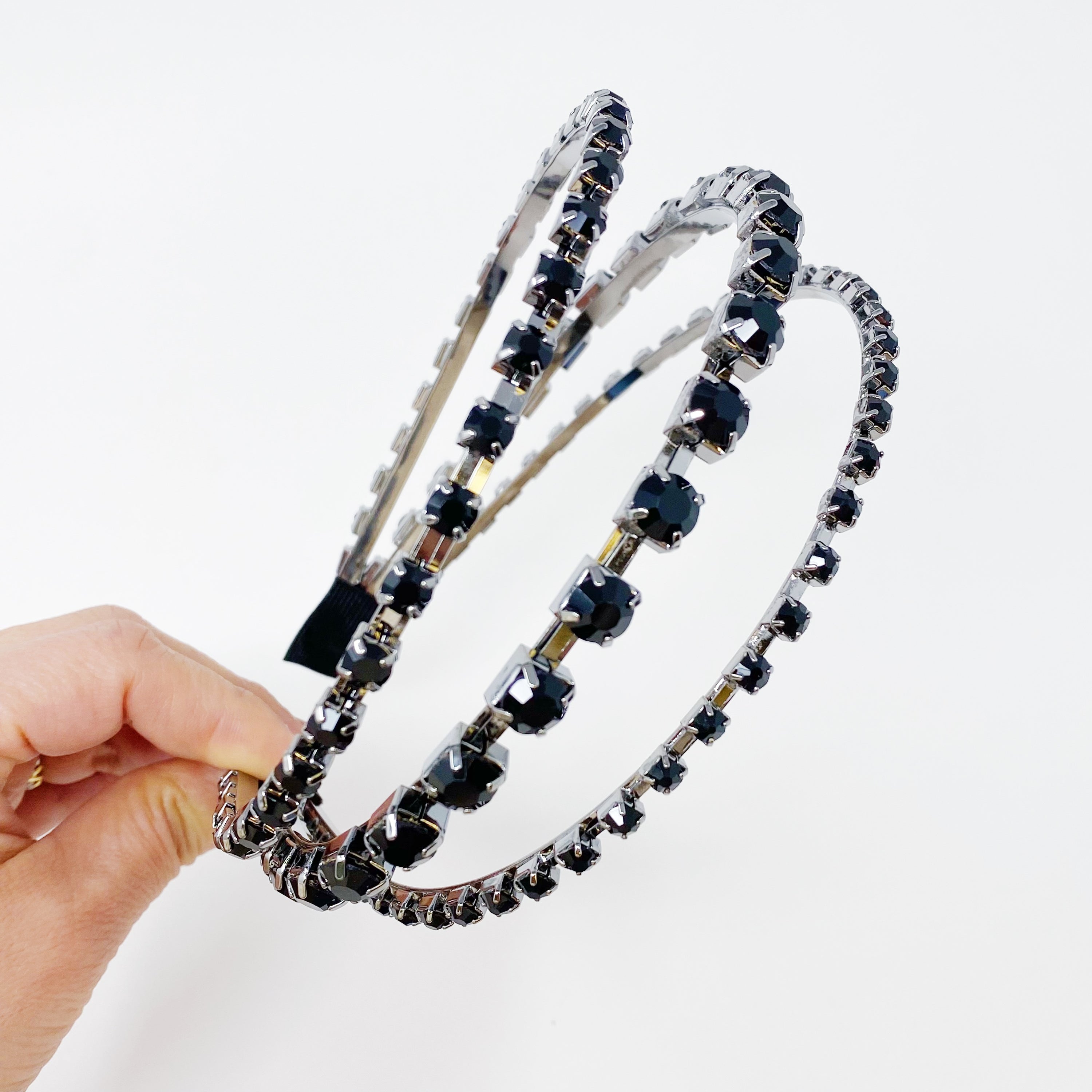 Ensemble Of Shine Headband featuring three embellished rows and soft edges for comfort.