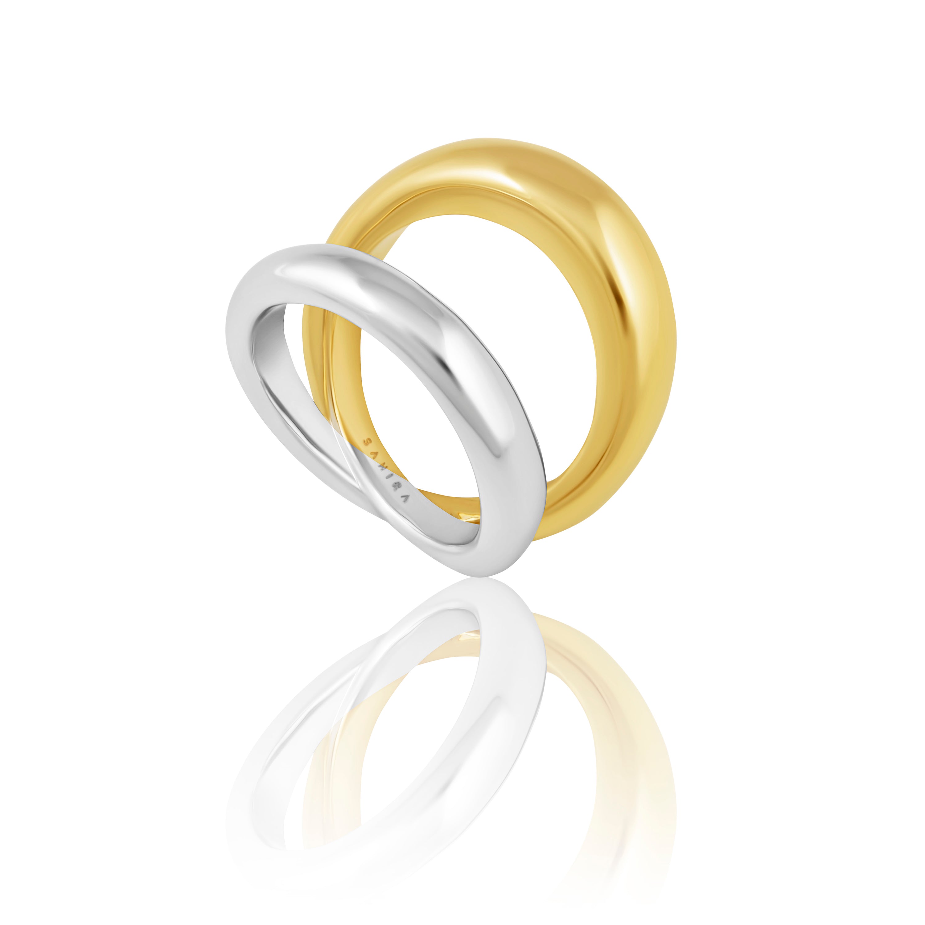 Erica Two-Tone Ring featuring a double band design in gold and silver tones, elegantly displayed on a soft background.