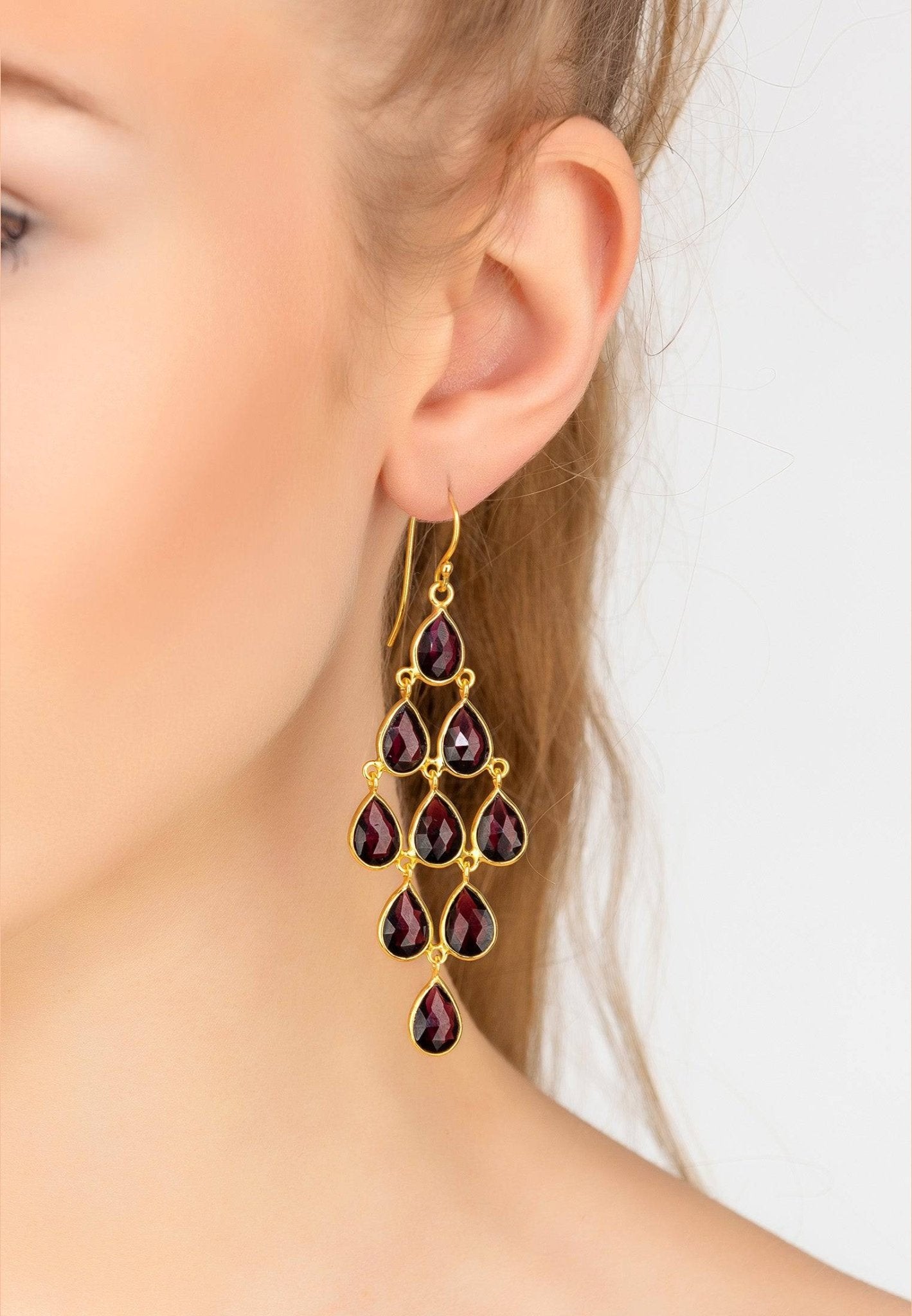 Erviola Gemstone Cascade Earrings featuring nine teardrop garnet gemstones on a gold-dipped sterling silver hook.