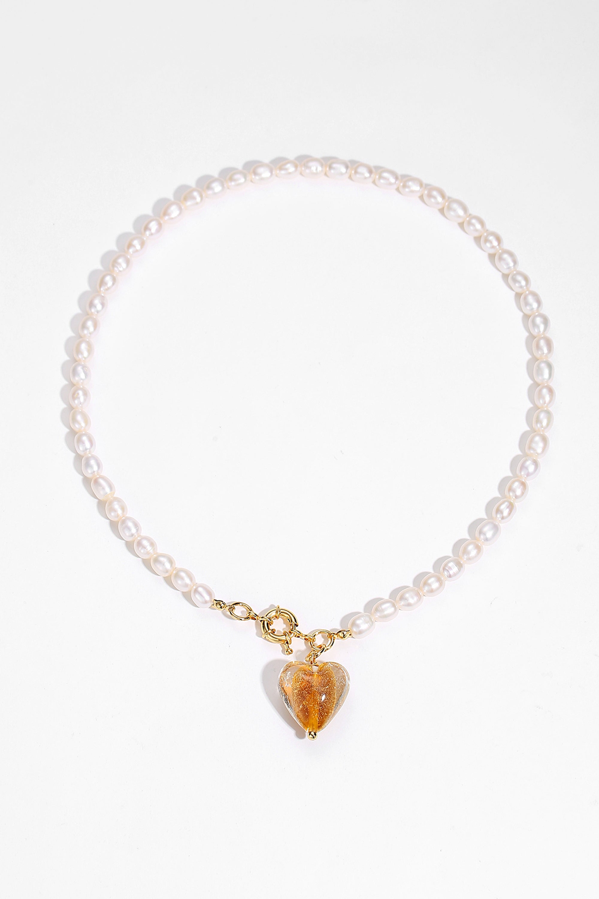 Esmée Amber Glaze Heart Pendant Pearl Necklace featuring baroque pearls and colorful glass pendant, elegantly displayed on a soft background.