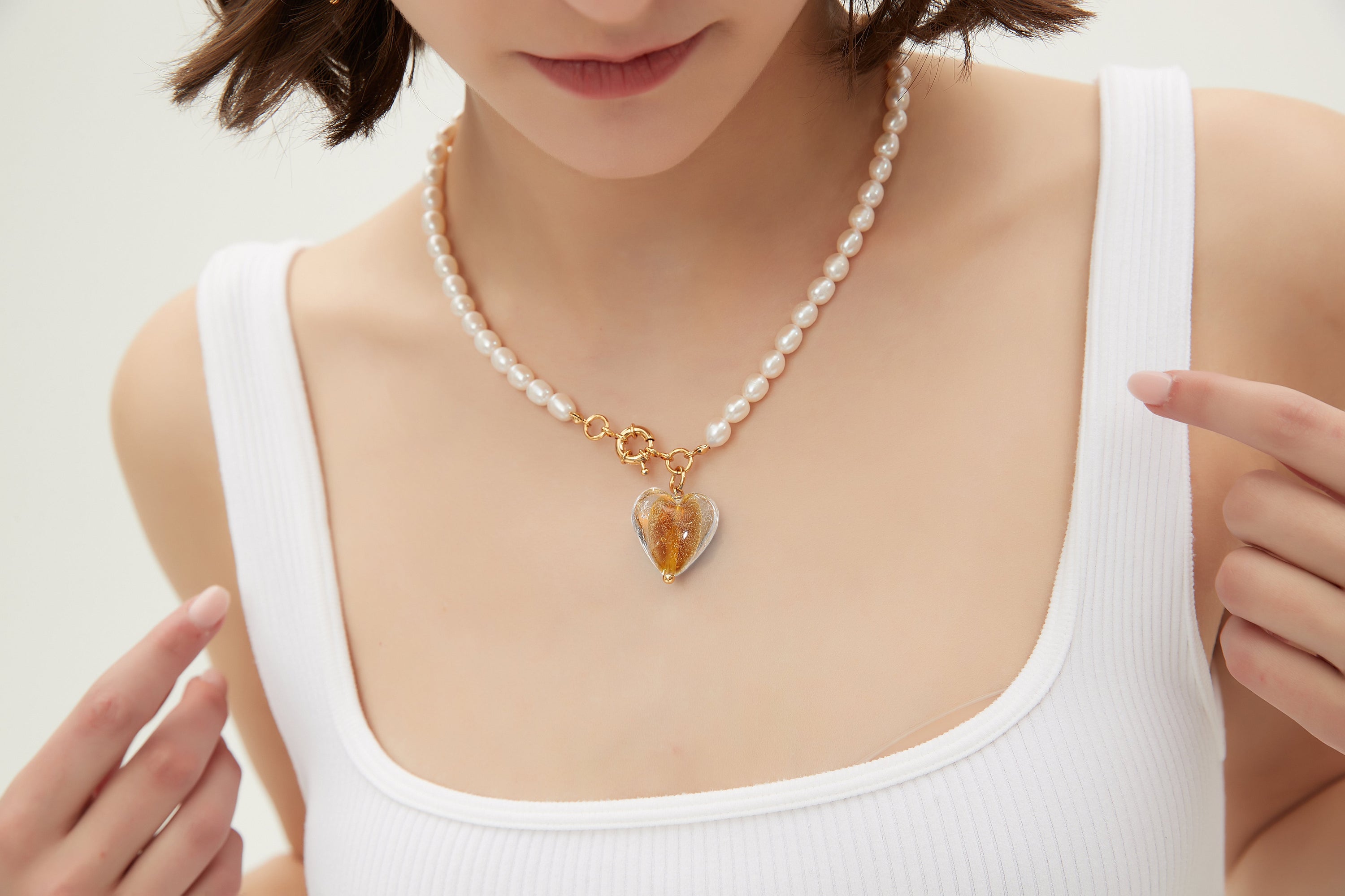 Esmée Amber Glaze Heart Pendant Pearl Necklace featuring baroque pearls and colorful glass pendant, elegantly displayed on a soft background.