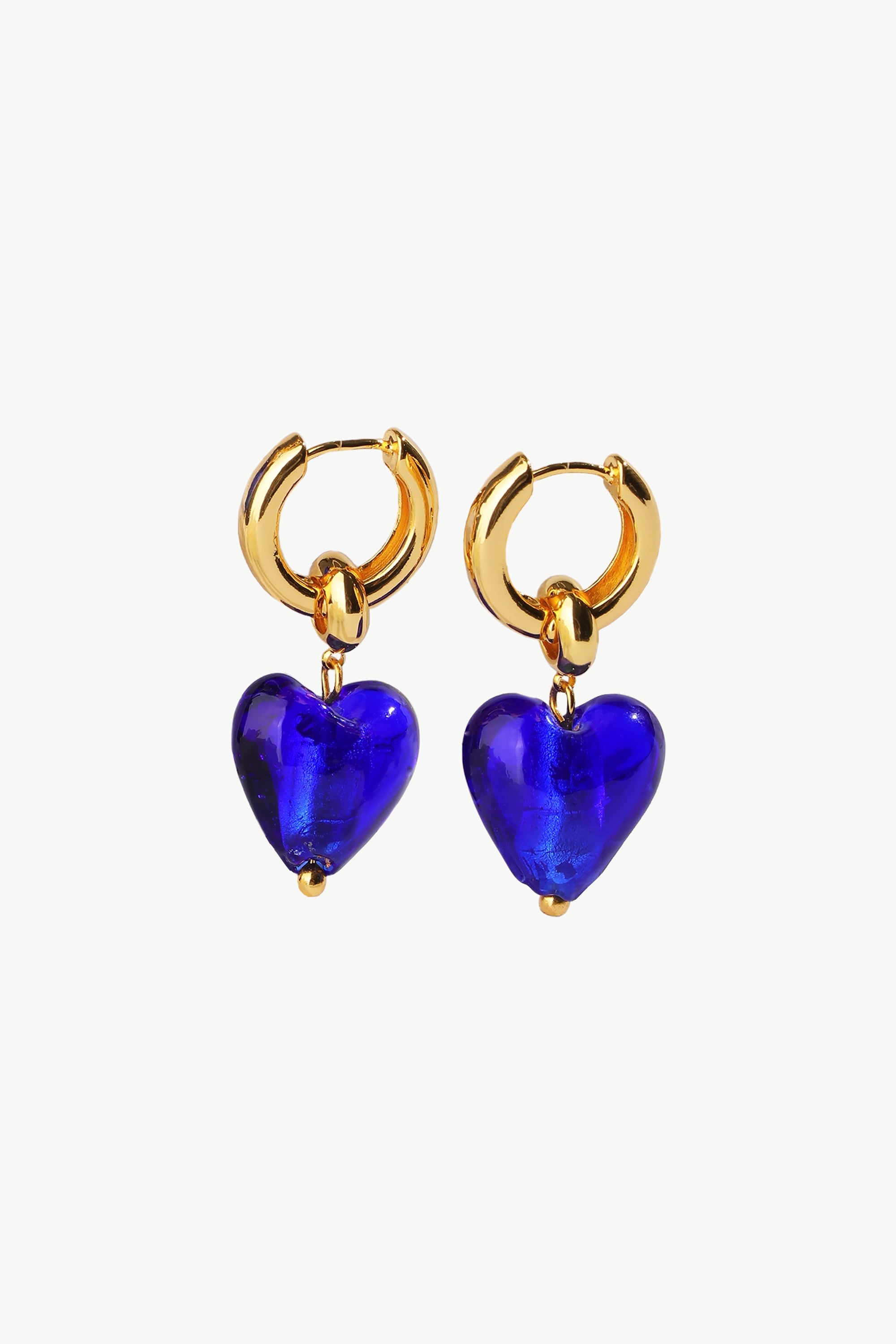 Esmée Blue Glaze Heart Dangle Earrings featuring colorful glass hearts and 18k gold plated hoops, showcasing unique handmade craftsmanship.