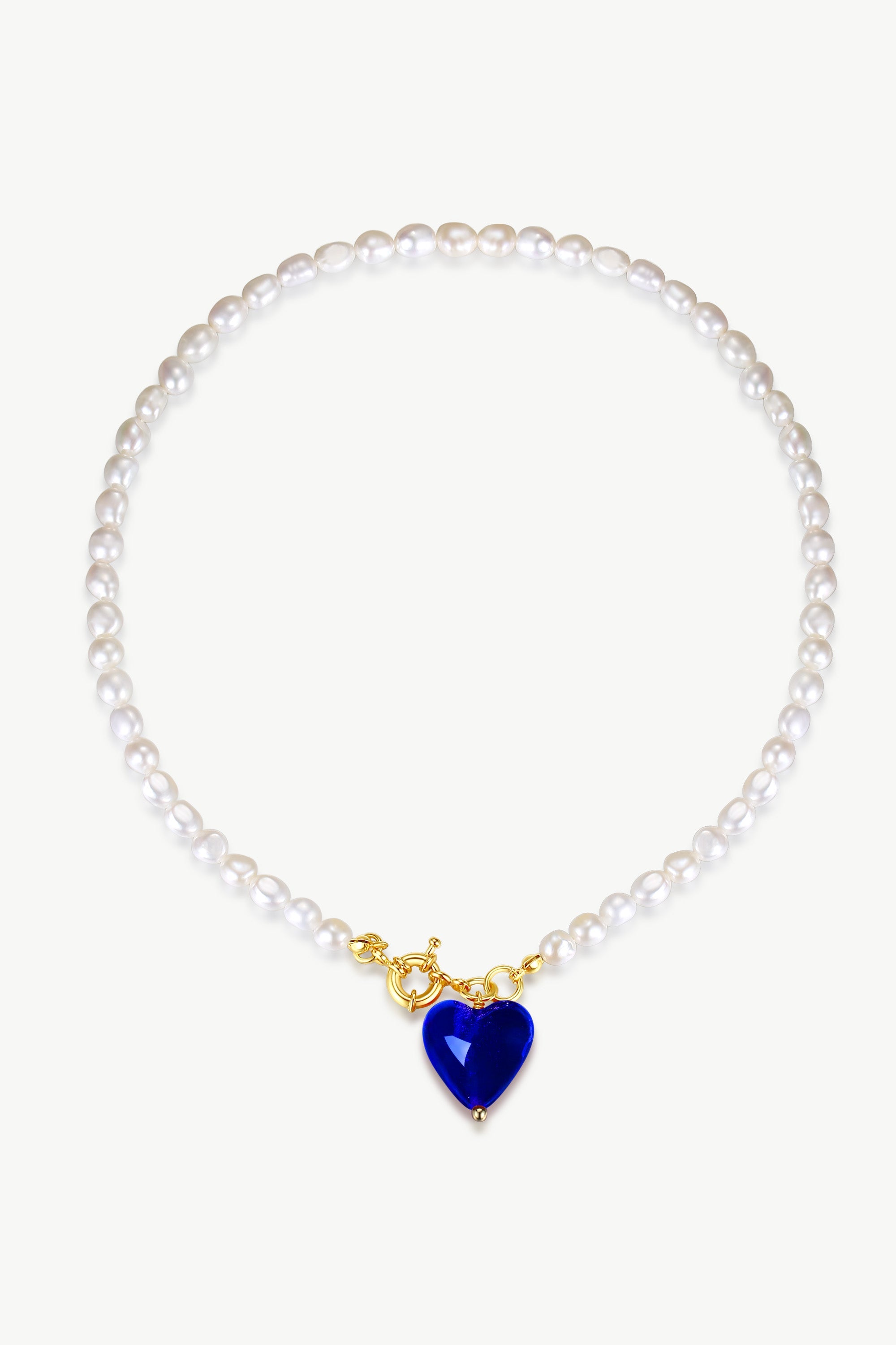 Esmée Blue Glaze Heart Pendant Pearl Necklace featuring baroque pearls and colorful glass heart pendant, elegantly displayed on a soft background.