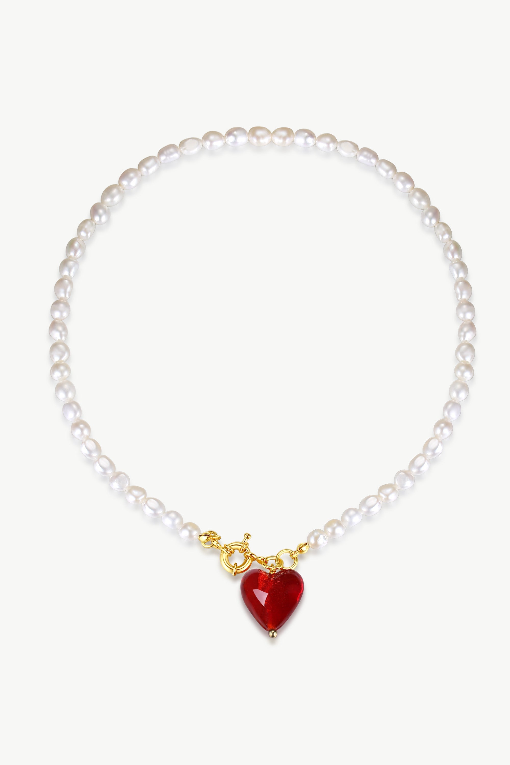 Esmée Red Glaze Heart Pendant Pearl Necklace featuring lustrous baroque pearls and a colorful glass heart pendant, elegantly displayed.