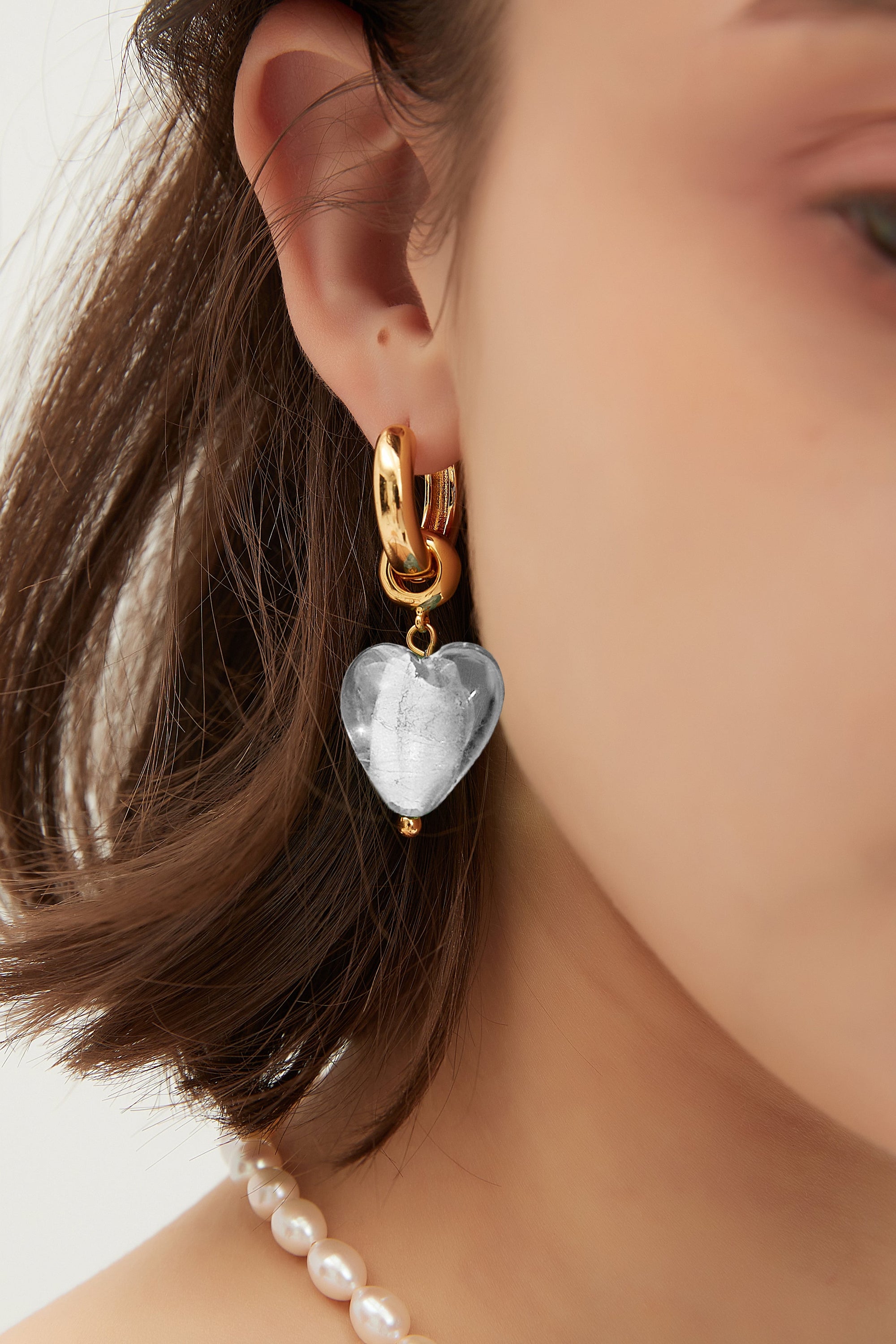 Esmée White Clear Glaze Heart Dangle Earrings featuring colorful glass hearts and 18k gold plated hoops.