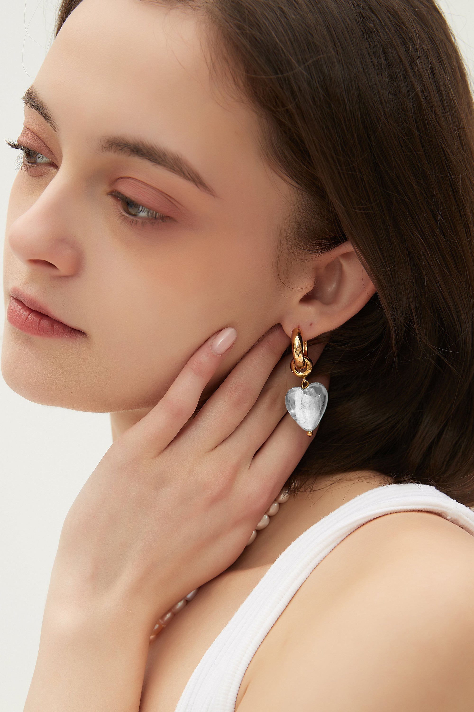 Esmée White Clear Glaze Heart Dangle Earrings featuring colorful glass hearts and 18k gold plated hoops.