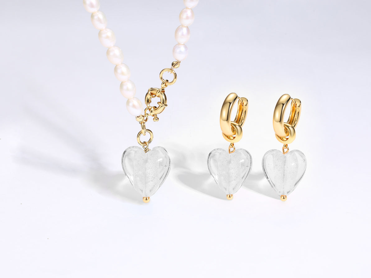 Esmée White Clear Glaze Heart Dangle Earrings featuring colorful glass hearts and 18k gold plated hoops.