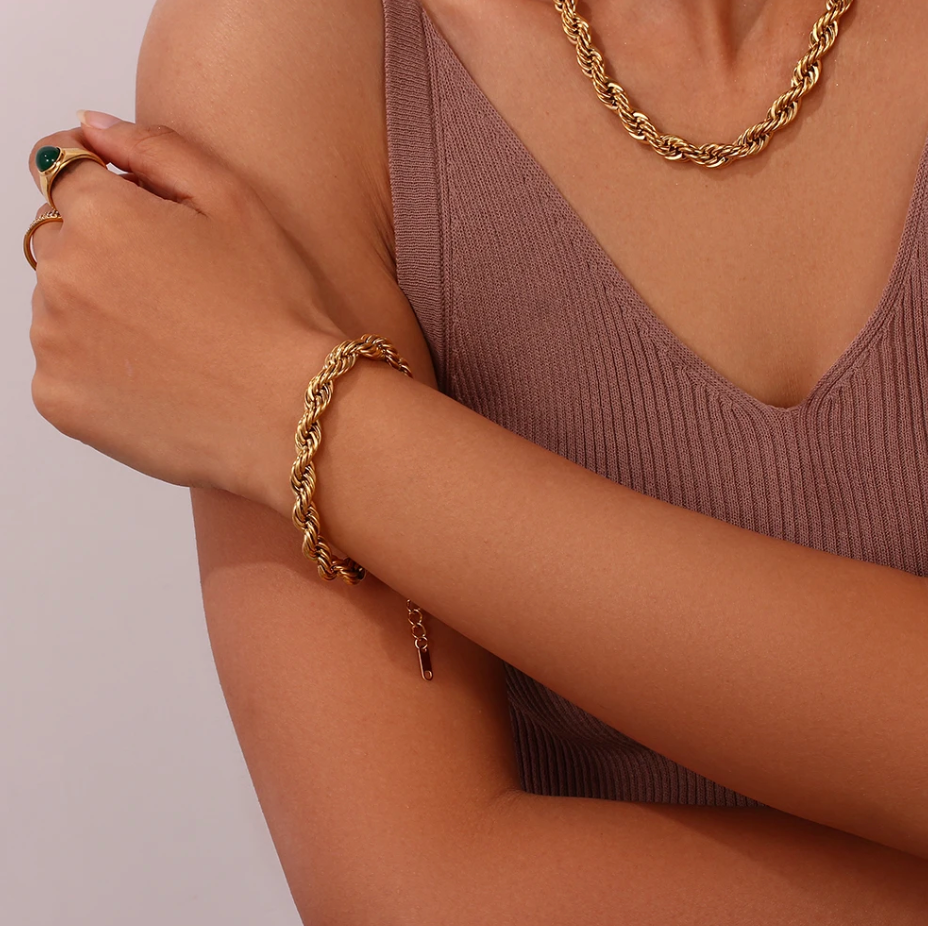 Esmeralda 8mm Twist Bracelet in gold, showcasing a chunky design with a luxurious finish, perfect for any occasion.