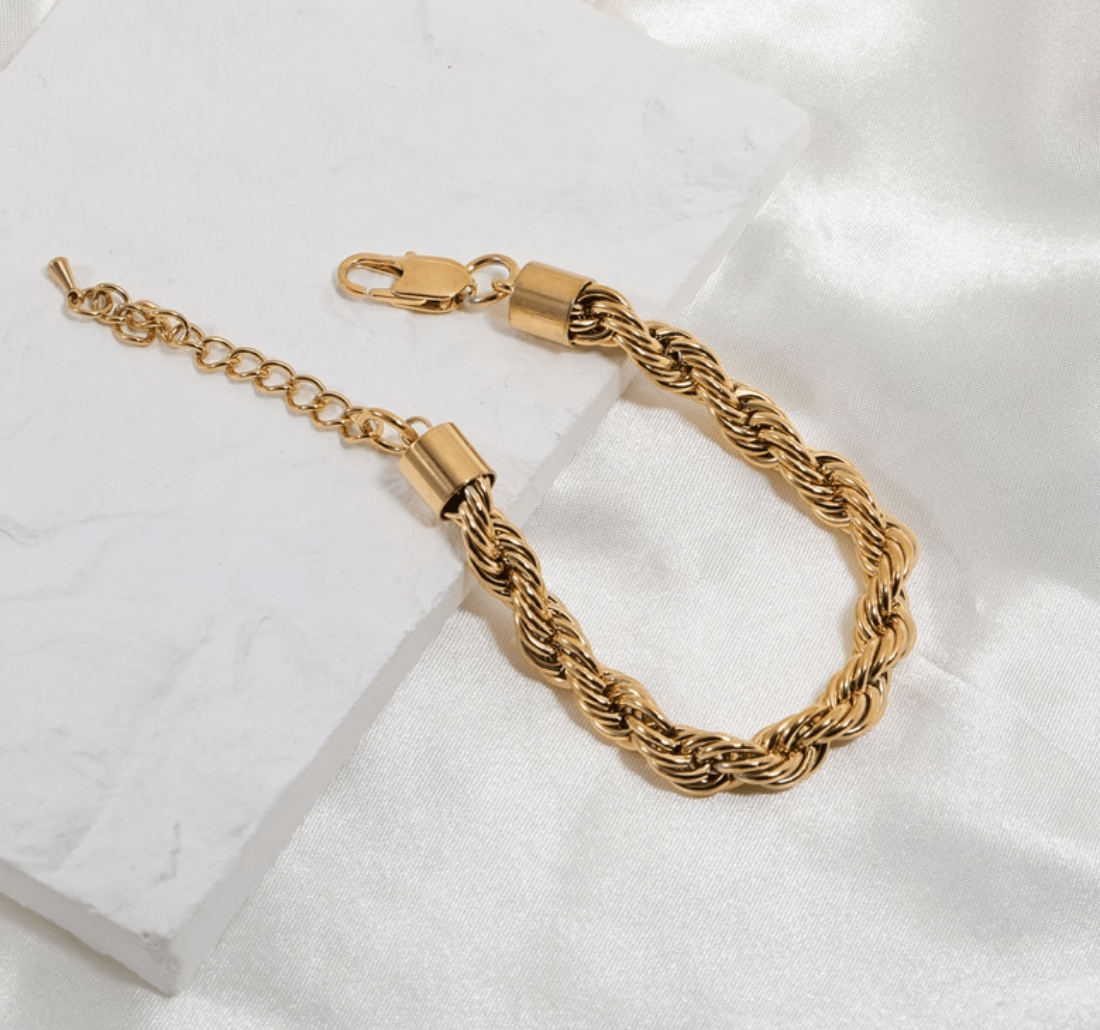 Esmeralda 8mm Twist Bracelet in gold, showcasing a chunky design with a luxurious finish, perfect for any occasion.