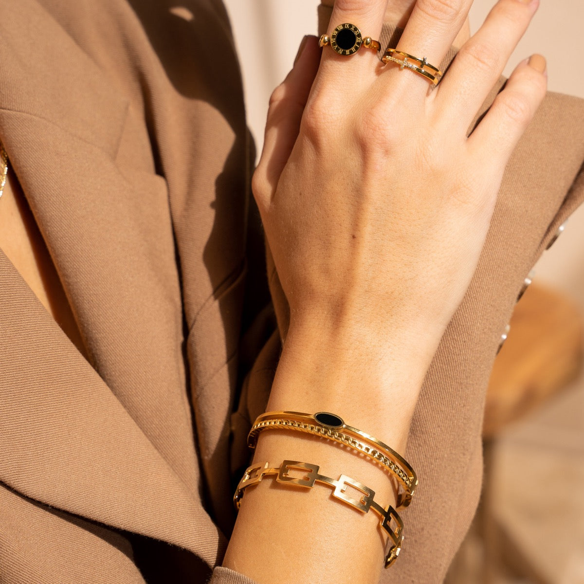 Esra Oval Onyx Layered Bangle in gold, showcasing its elegant design and premium quality materials.