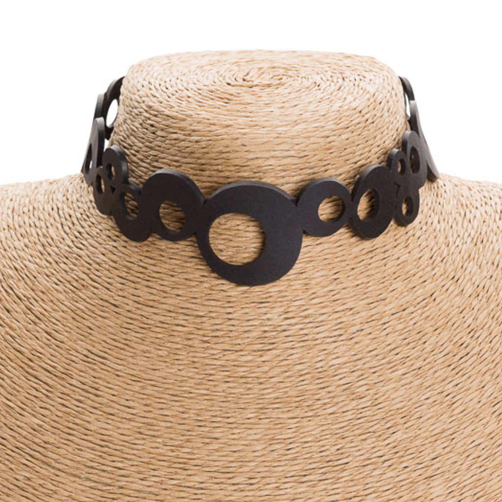 Eternity Recycled Rubber Choker featuring adjustable buttons and unique texture, perfect for bohemian style.