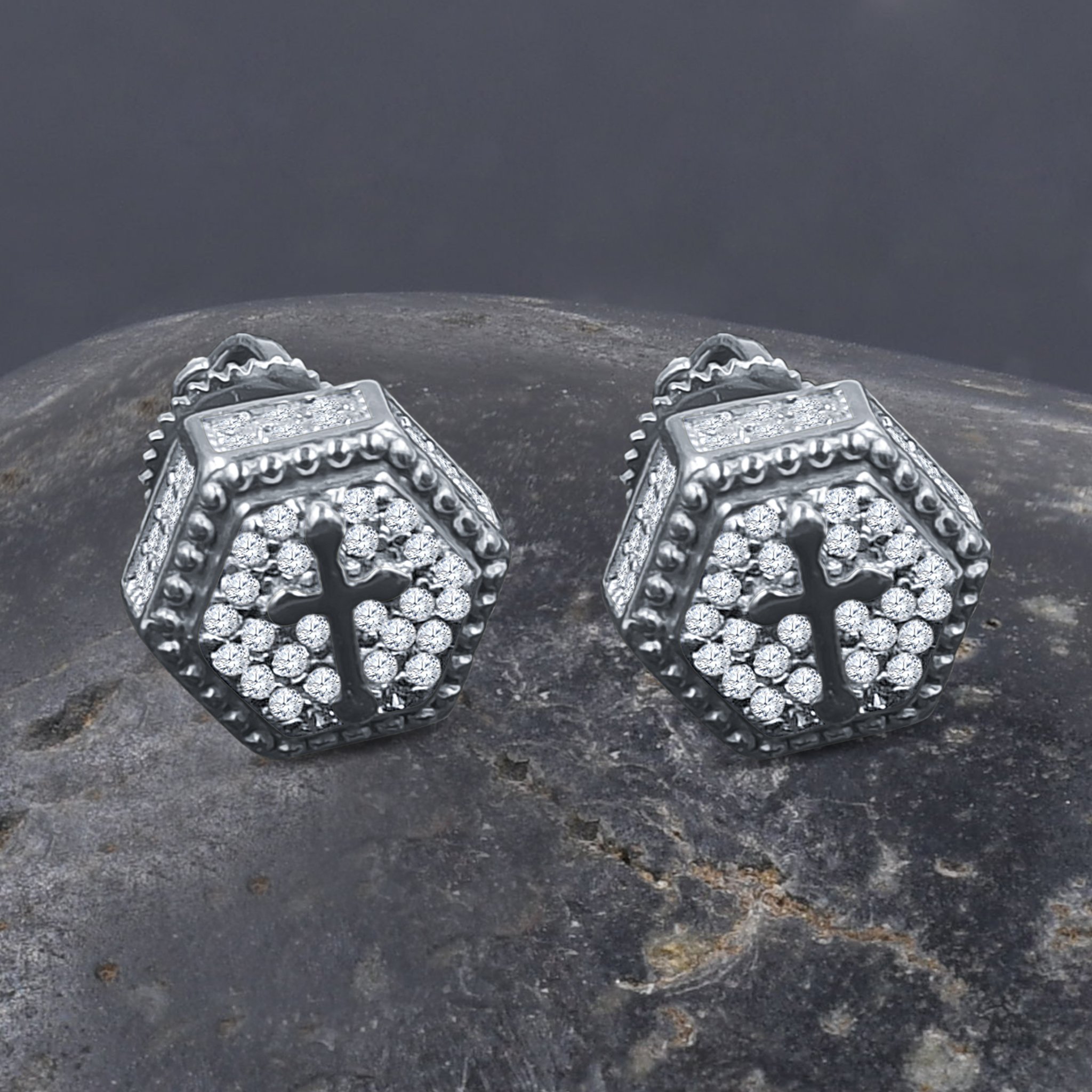 A pair of Ethereal Silver Earrings featuring sparkling cubic zircon stones and a unique cross design, crafted from 925 sterling silver.