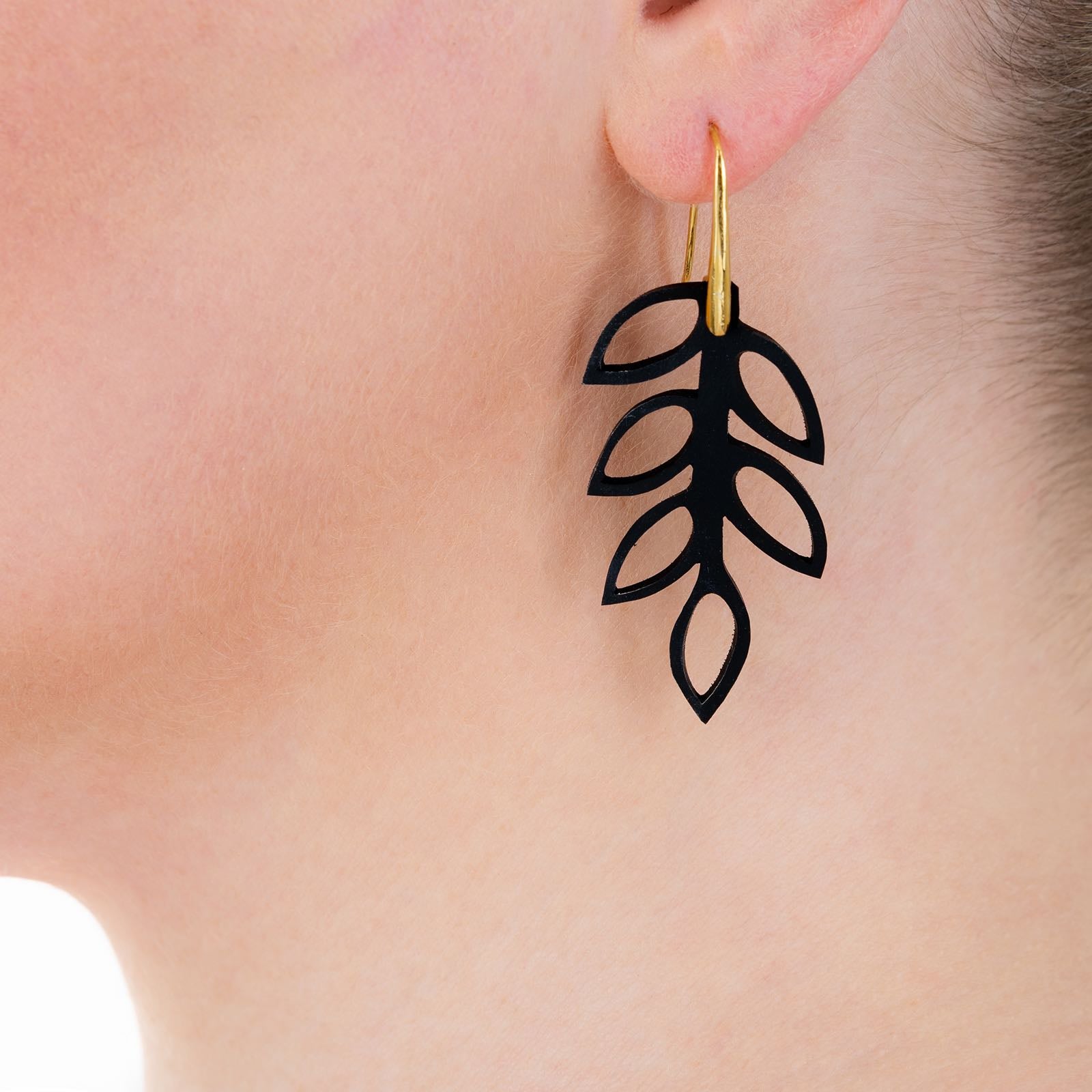 Elegant Evergreen Leaf Recycled Rubber Earrings handcrafted from reclaimed tyre inner tubes with gold plated hooks.