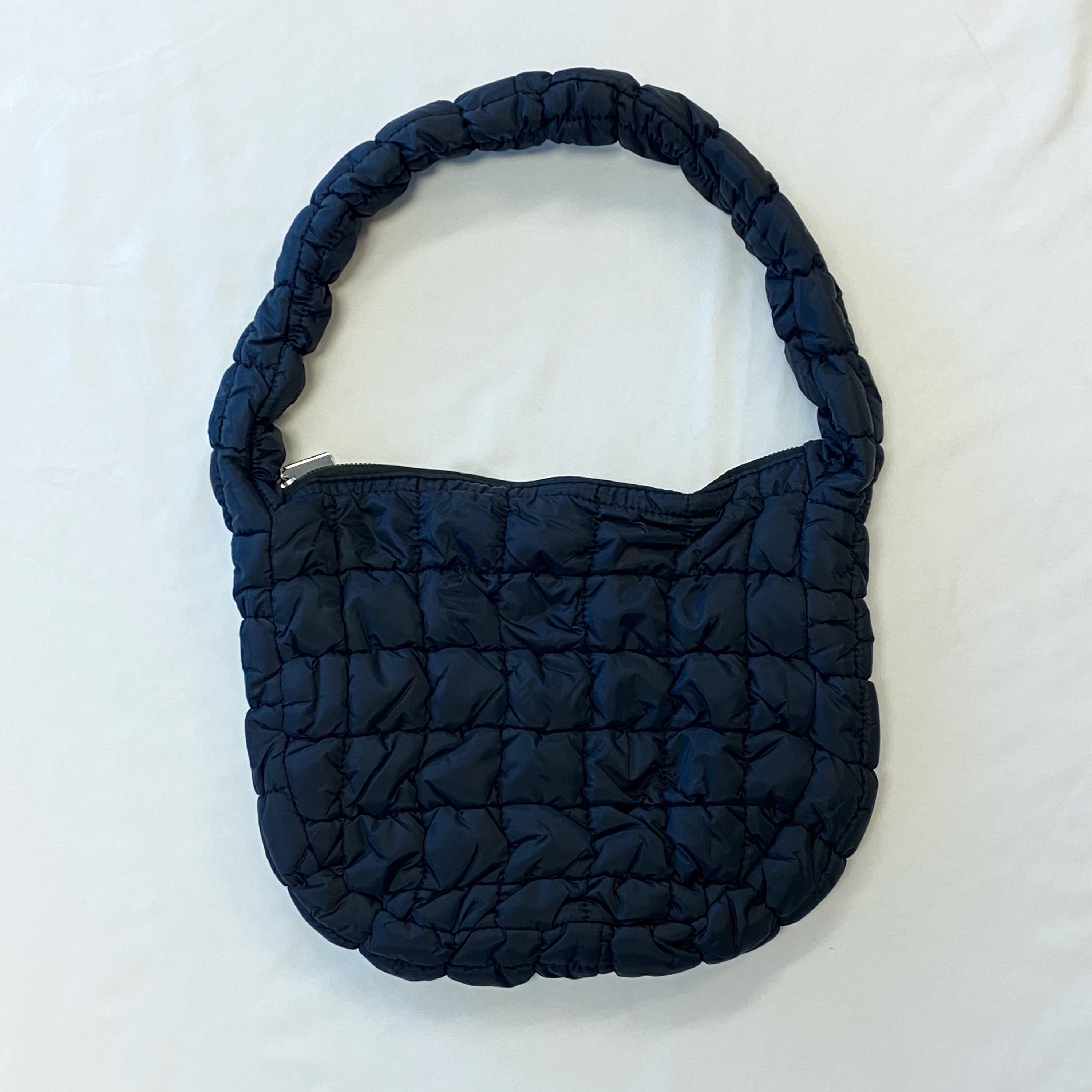 Everyday All At Once Quilted Bag in a stylish quilted design, showcasing its spacious interior and comfortable shoulder strap.