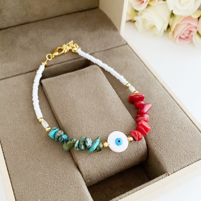 Evil Eye Anklet featuring mother of pearl evil eye bead and baroque beads, handmade with seed beads in a stylish boho design.