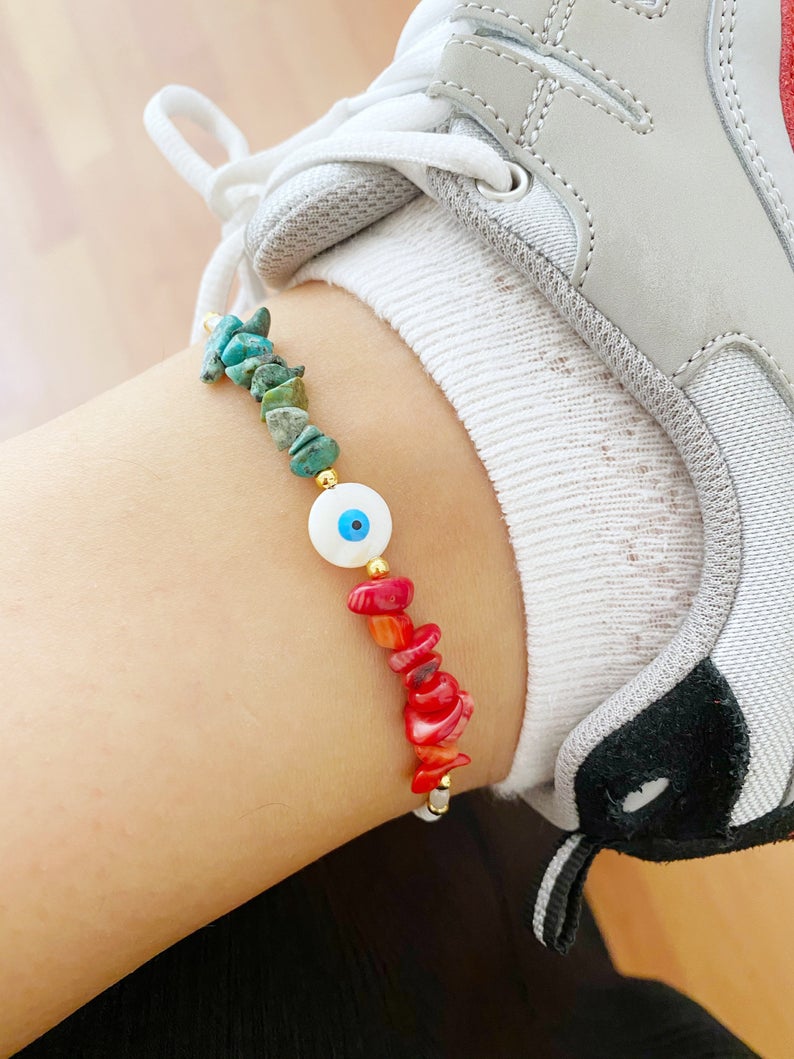 Evil Eye Anklet featuring mother of pearl evil eye bead and baroque beads, handmade with seed beads in a stylish boho design.