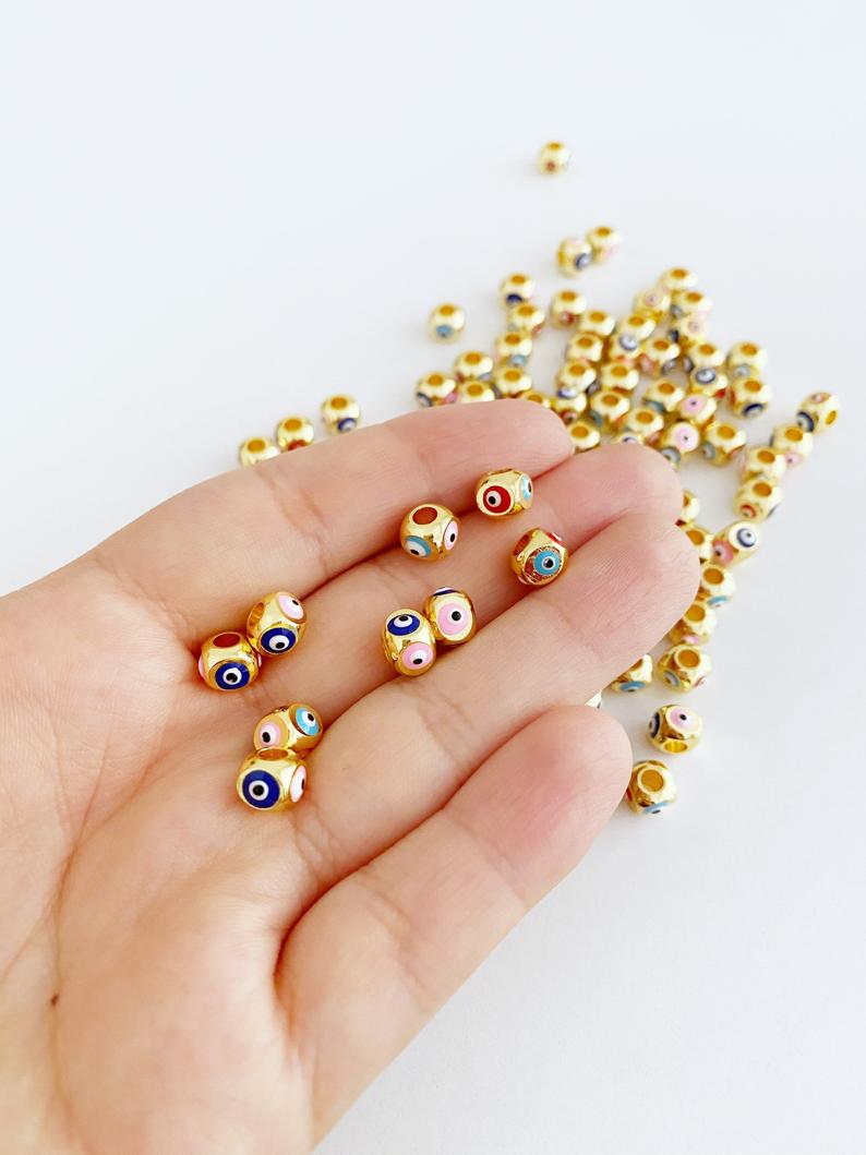 Colorful Evil Eye Beads with square shape, featuring protective symbols on all four sides, made of durable brass material.