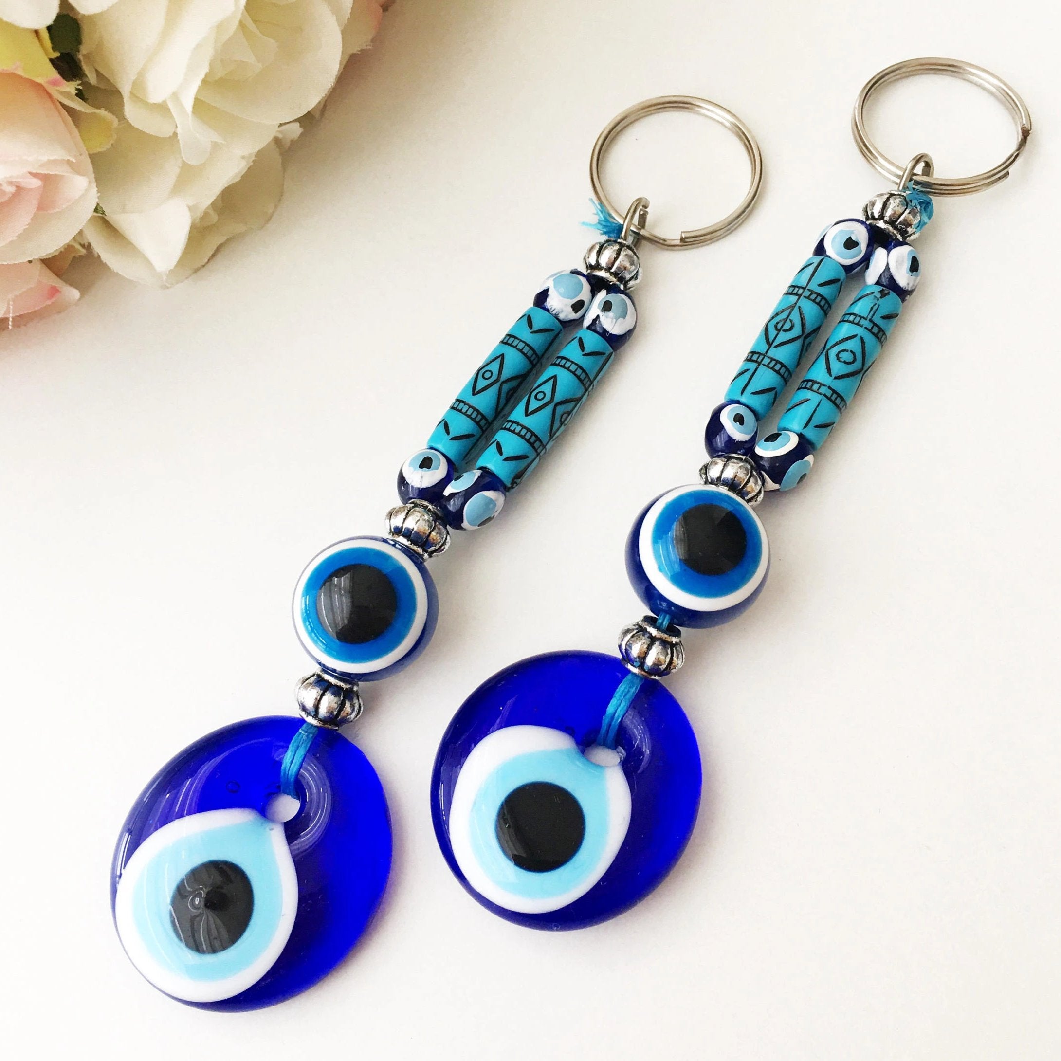 Evil Eye Boho Keyring featuring a vibrant blue and white evil eye design, perfect for keys or bags.