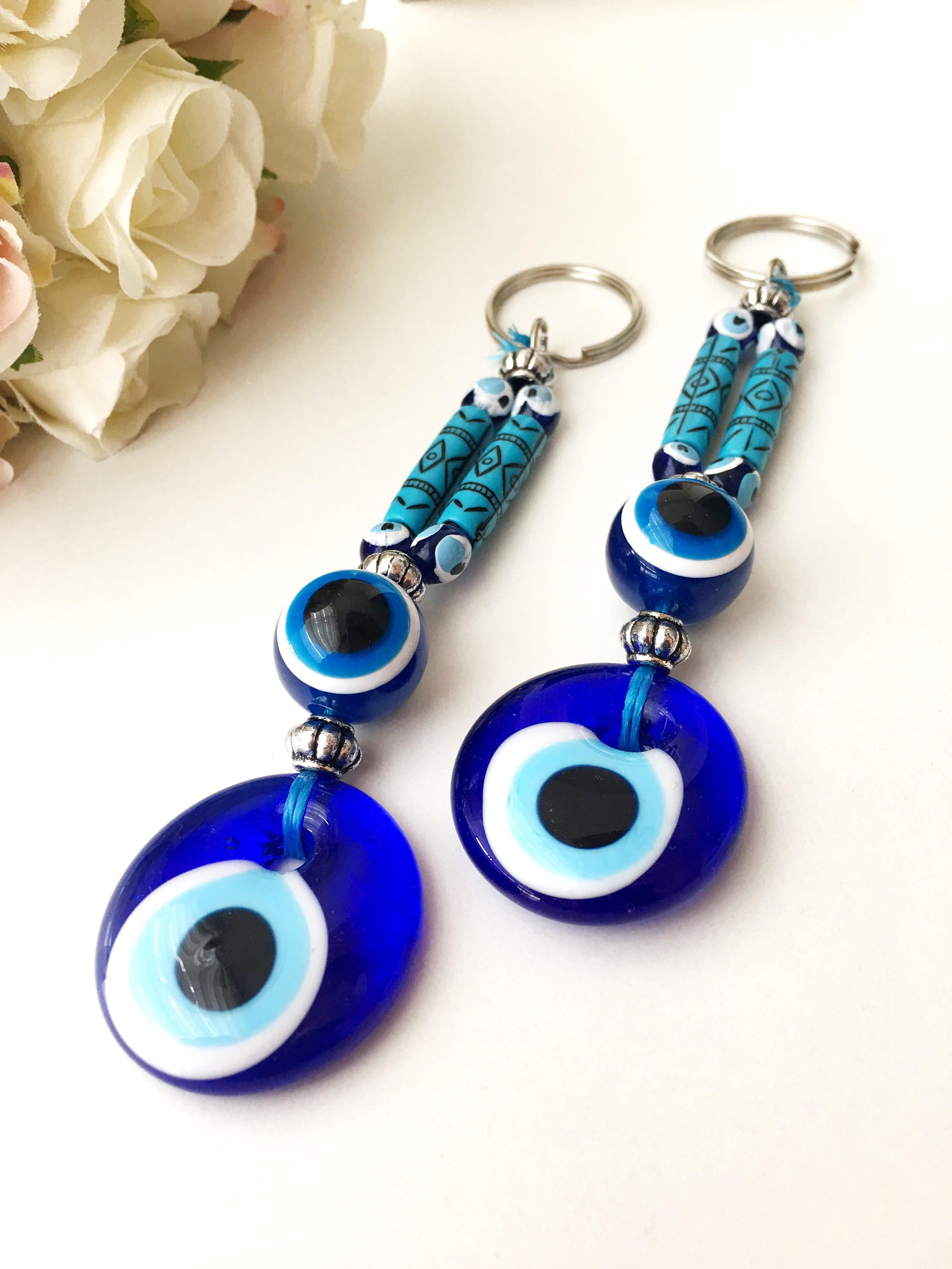 Evil Eye Boho Keyring featuring a vibrant blue and white evil eye design, perfect for keys or bags.