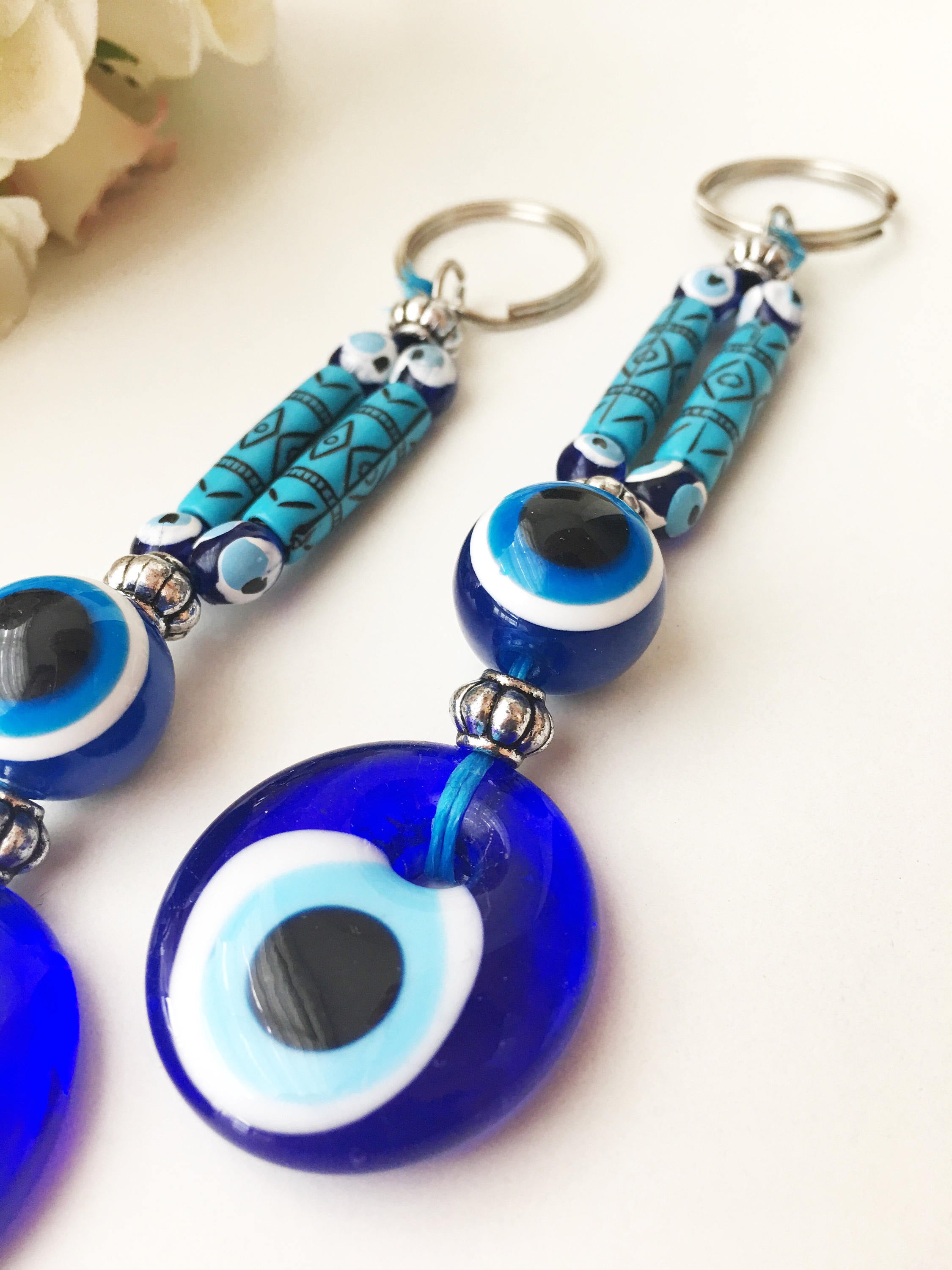 Evil Eye Boho Keyring featuring a vibrant blue and white evil eye design, perfect for keys or bags.