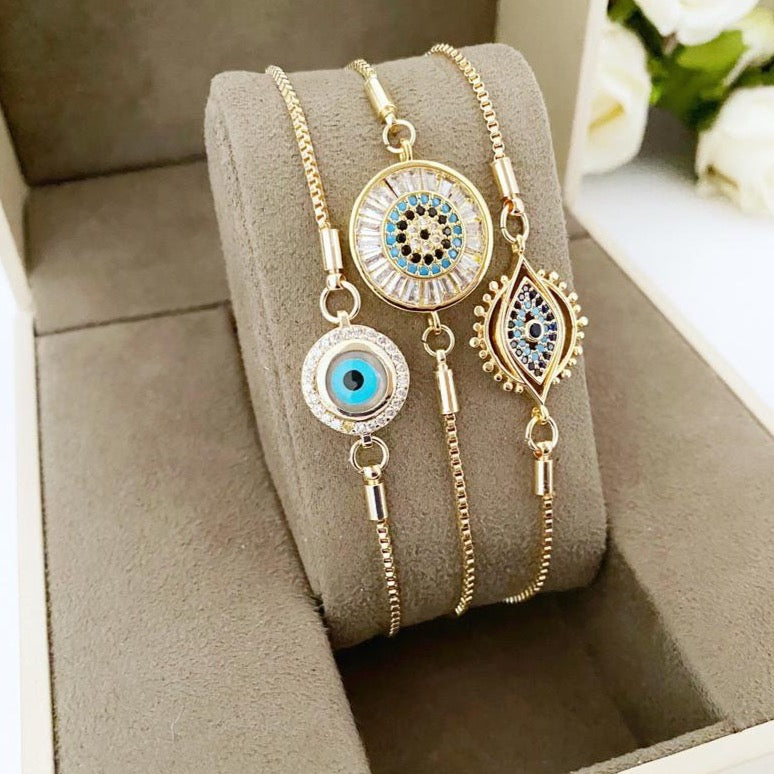 A beautiful adjustable Evil Eye Bracelet featuring a blue evil eye charm and sparkling cubic zirconia stones, crafted from tarnish-resistant stainless steel.