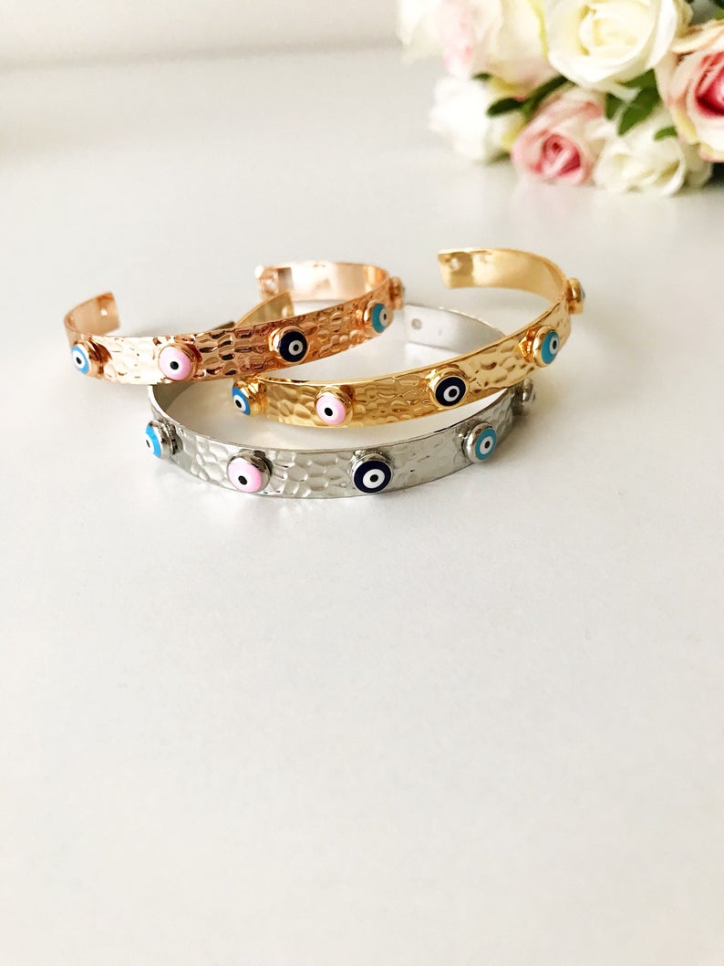 Evil Eye Bracelet featuring a movable oval charm, available in rose gold, gold, and silver, made from tarnish-resistant stainless steel.