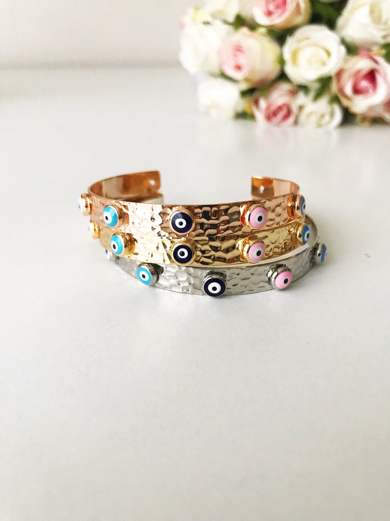 Evil Eye Bracelet featuring a movable oval charm, available in rose gold, gold, and silver, made from tarnish-resistant stainless steel.