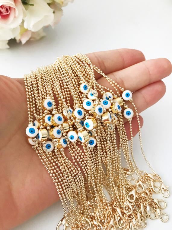 A beautiful gold evil eye bracelet featuring a blue evil eye bead, adjustable stainless steel chain, and available in four colors.