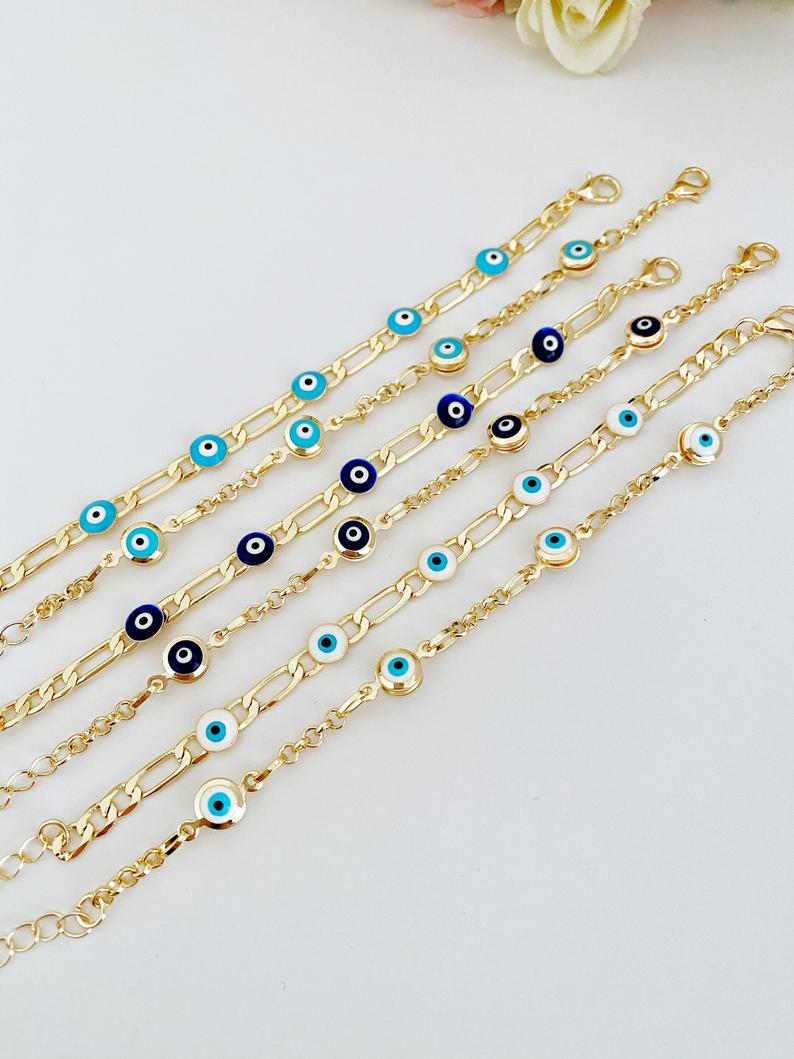 Elegant Evil Eye Bracelet featuring a gold link chain and blue evil eye charms, symbolizing protection and good luck.