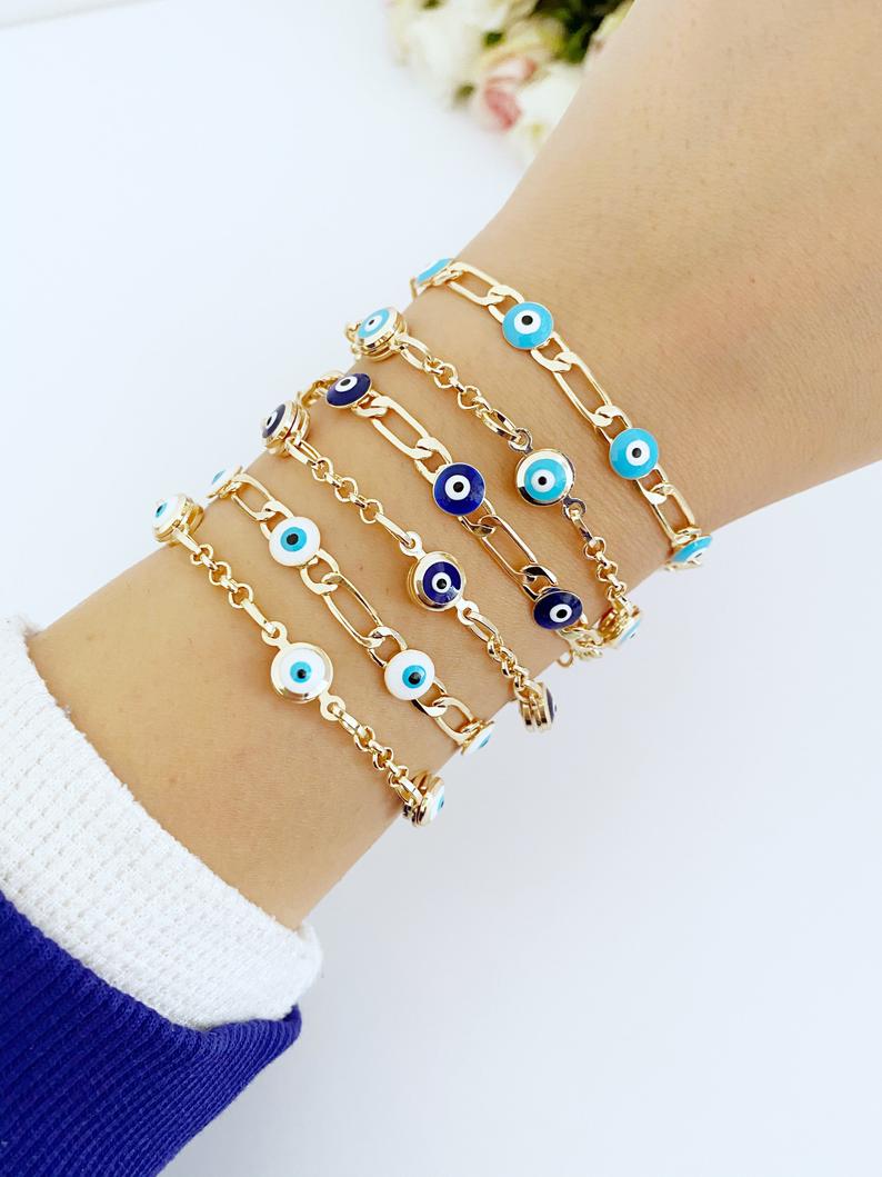 Elegant Evil Eye Bracelet featuring a gold link chain and blue evil eye charms, symbolizing protection and good luck.