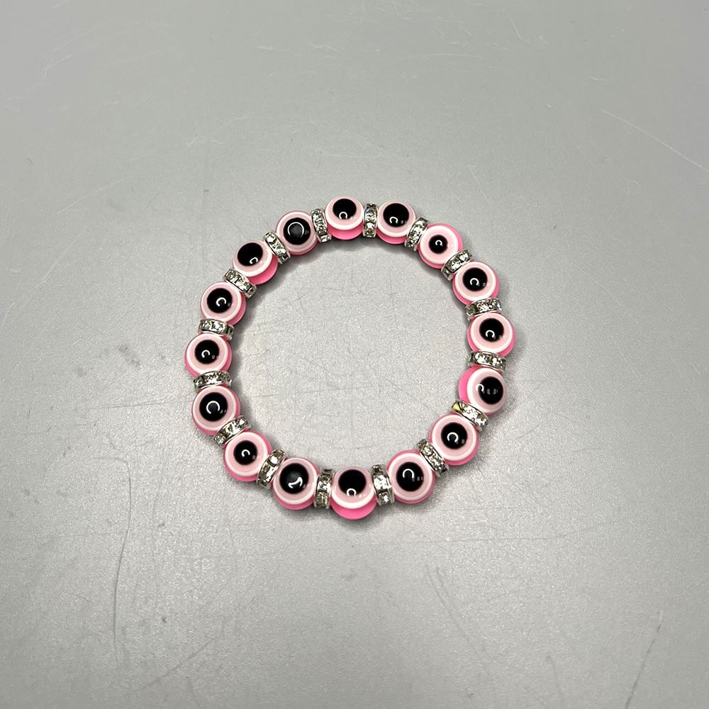 A beautifully crafted pink evil eye bracelet featuring a traditional charm, symbolizing protection and good luck, handmade with care.